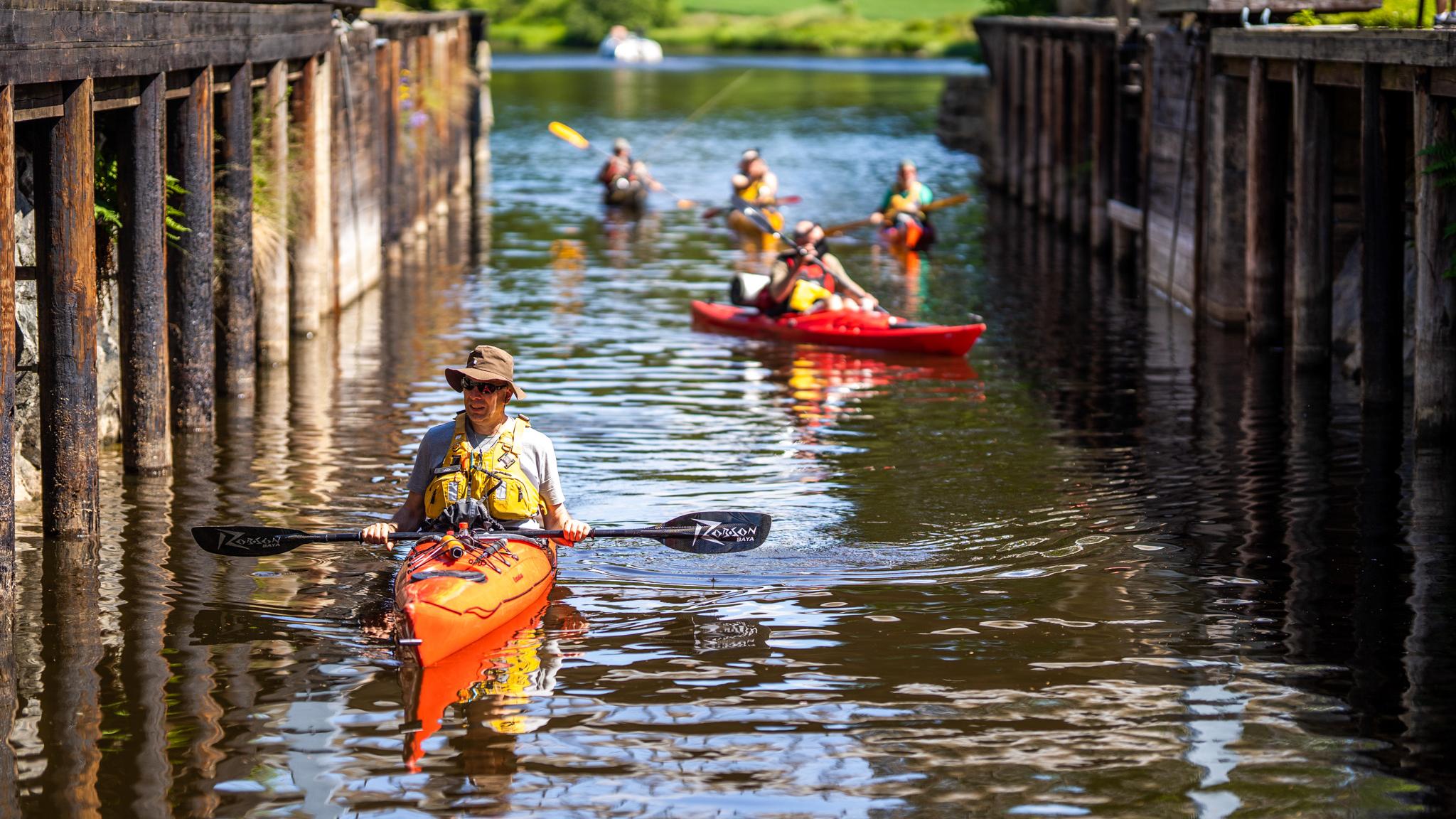 Kayaking in Strømsfoss locks in the Halden Canal, Eastern Norway.