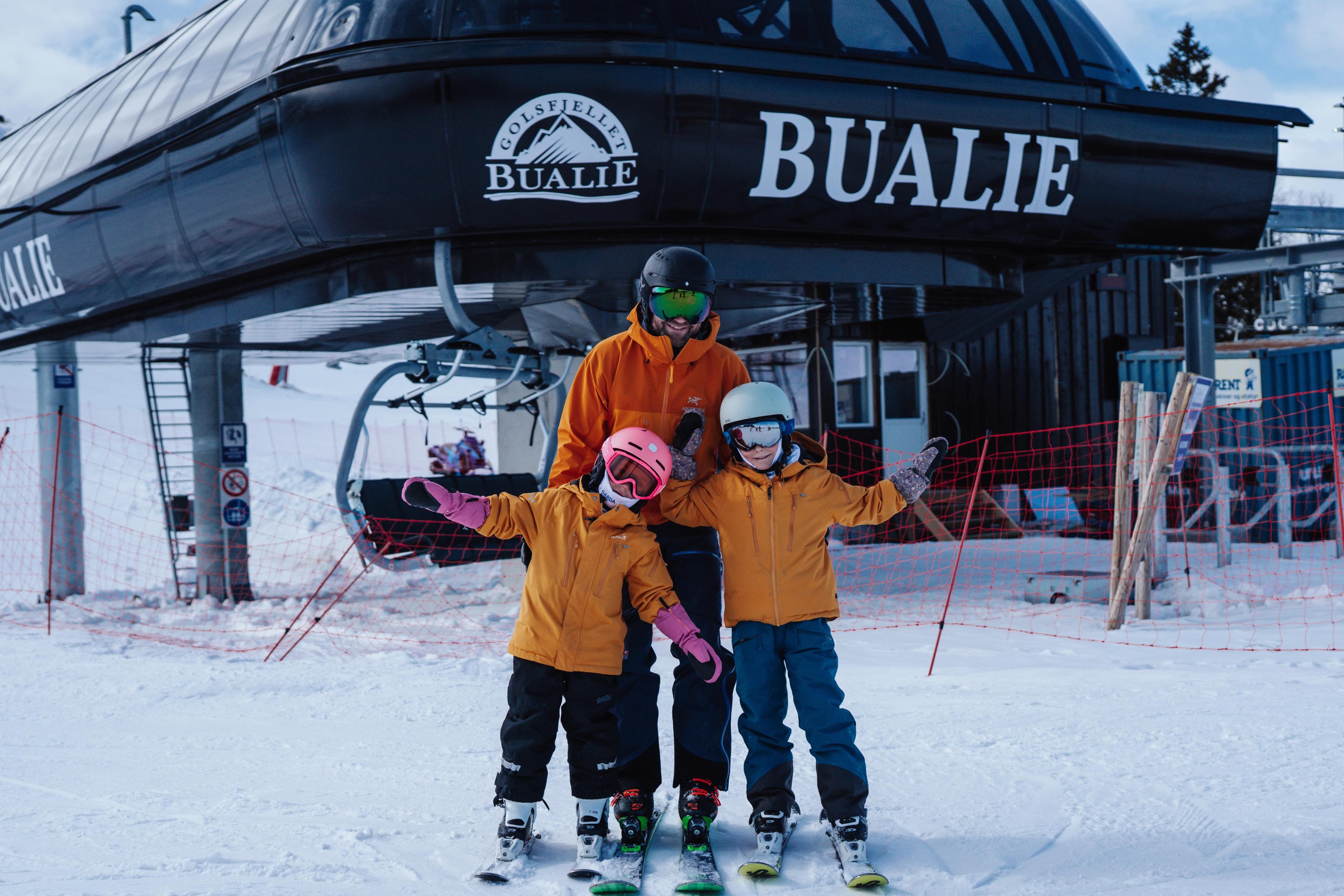 A family in front of Bualie in Gol, Eastern Norway.