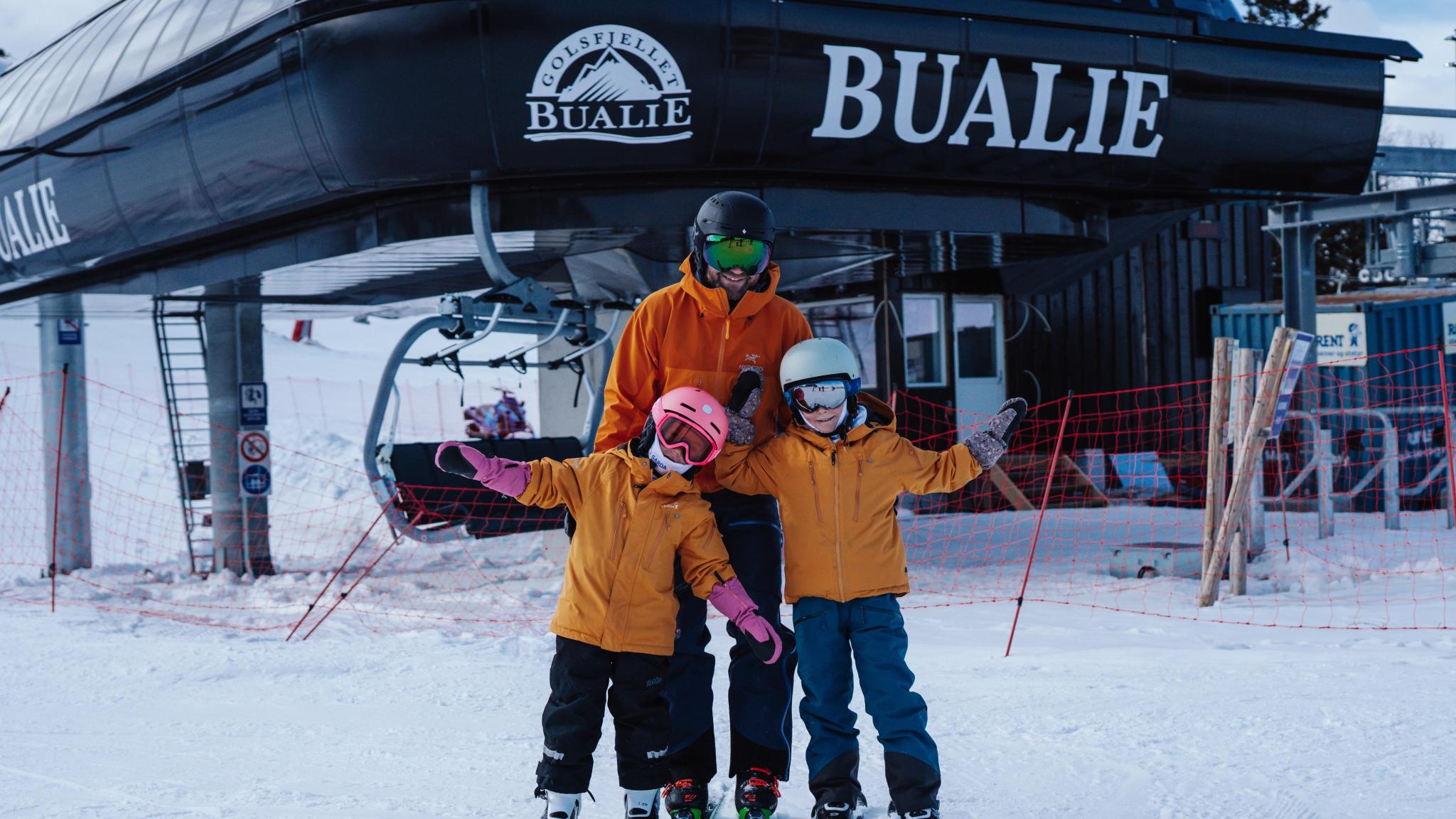 A family in front of Bualie in Gol, Eastern Norway.