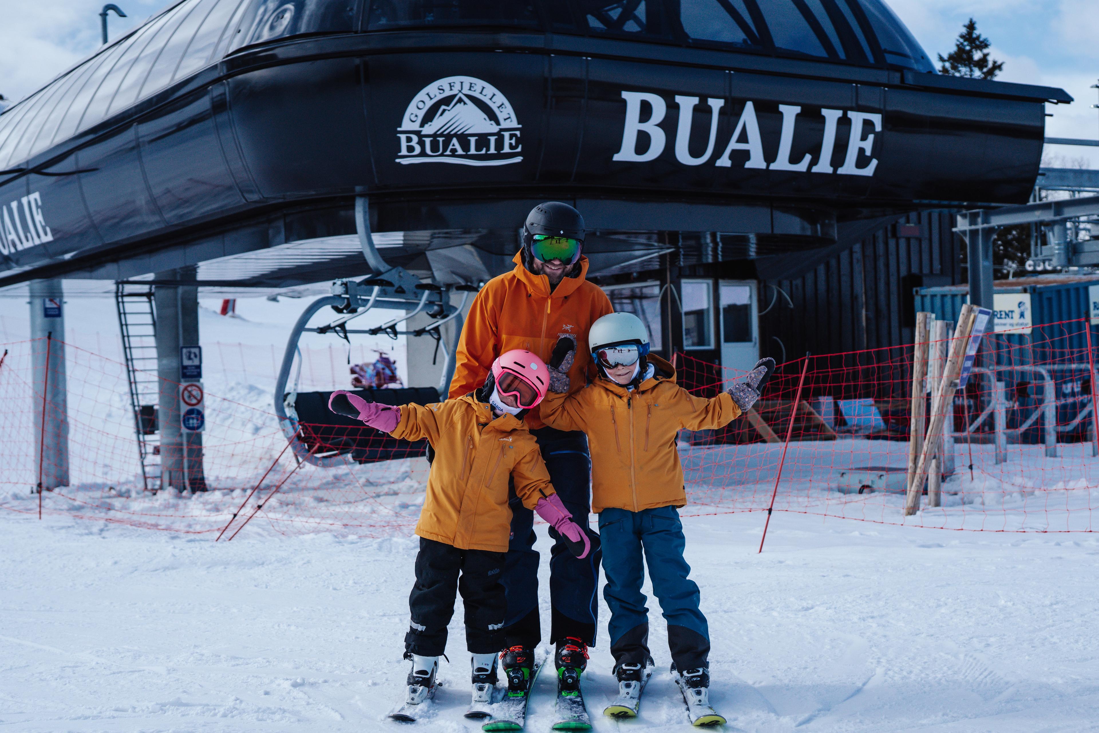A family in front of Bualie in Gol, Eastern Norway.