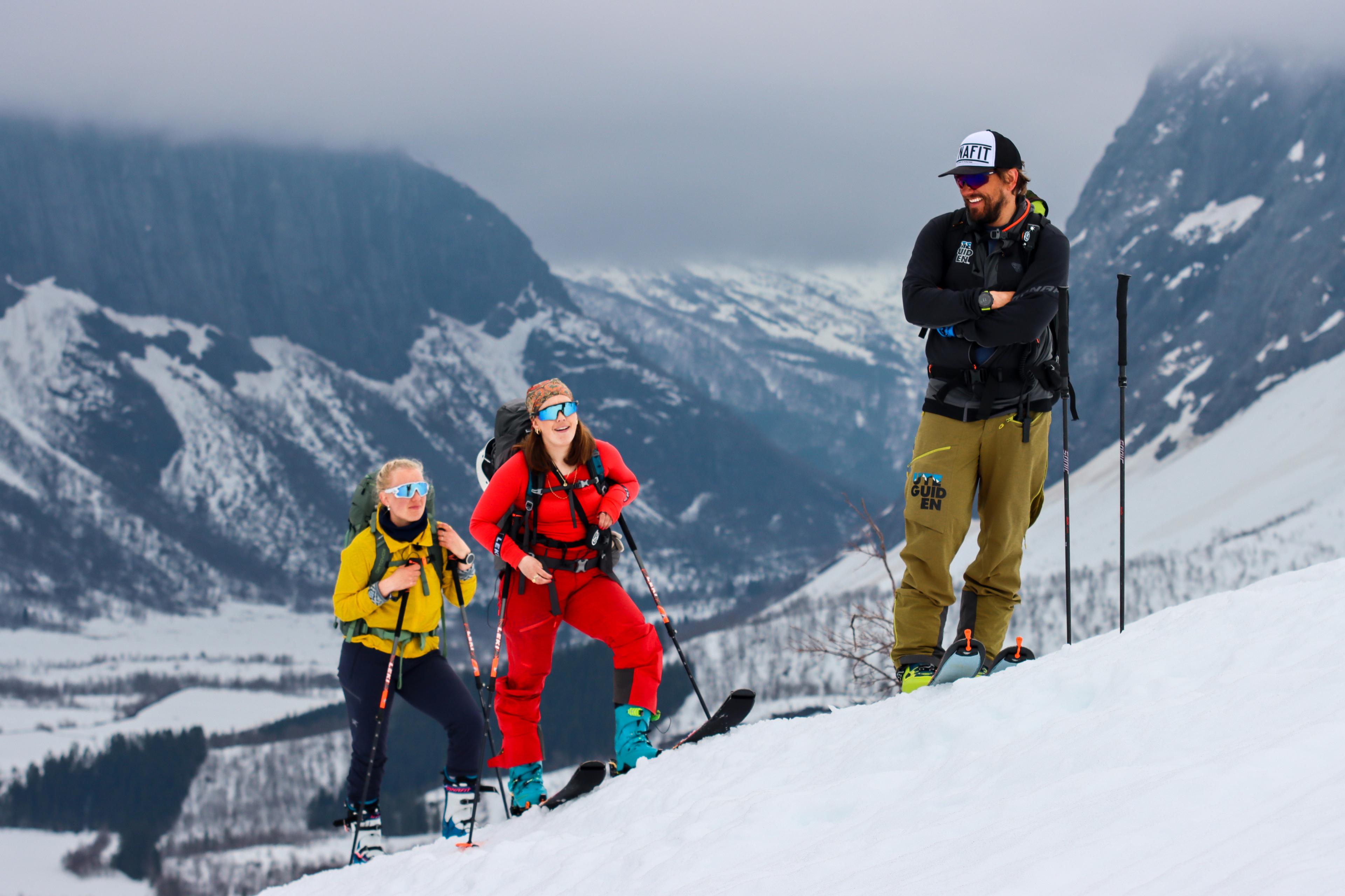 Two people with a guide going ski touring at Sunnmøre, Fjord Norway.