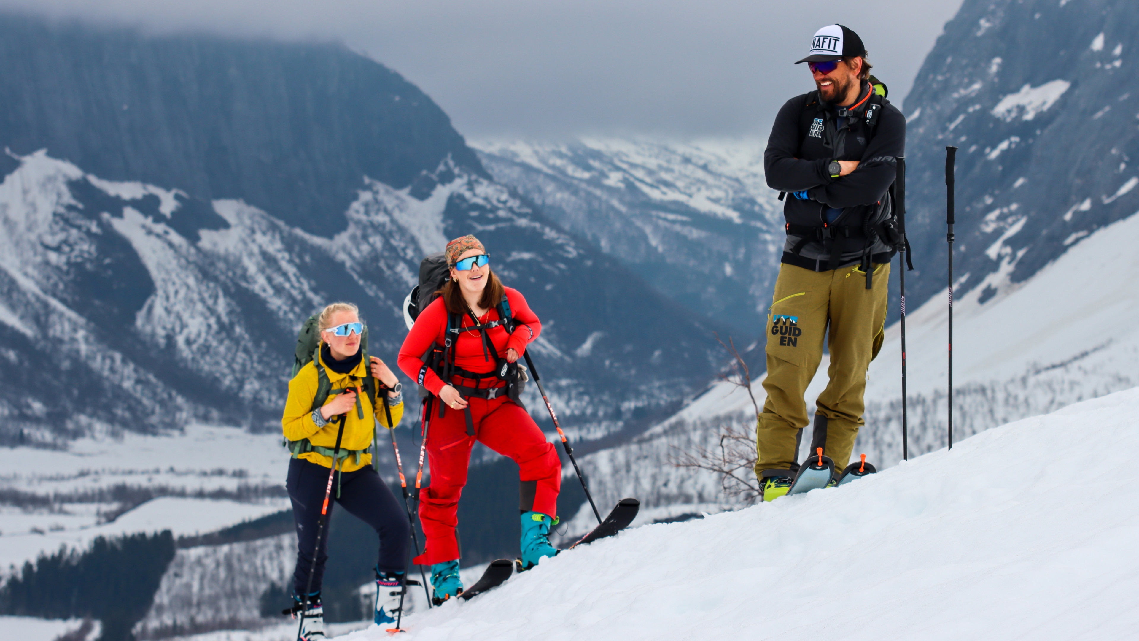 Two people with a guide going ski touring at Sunnmøre, Fjord Norway.