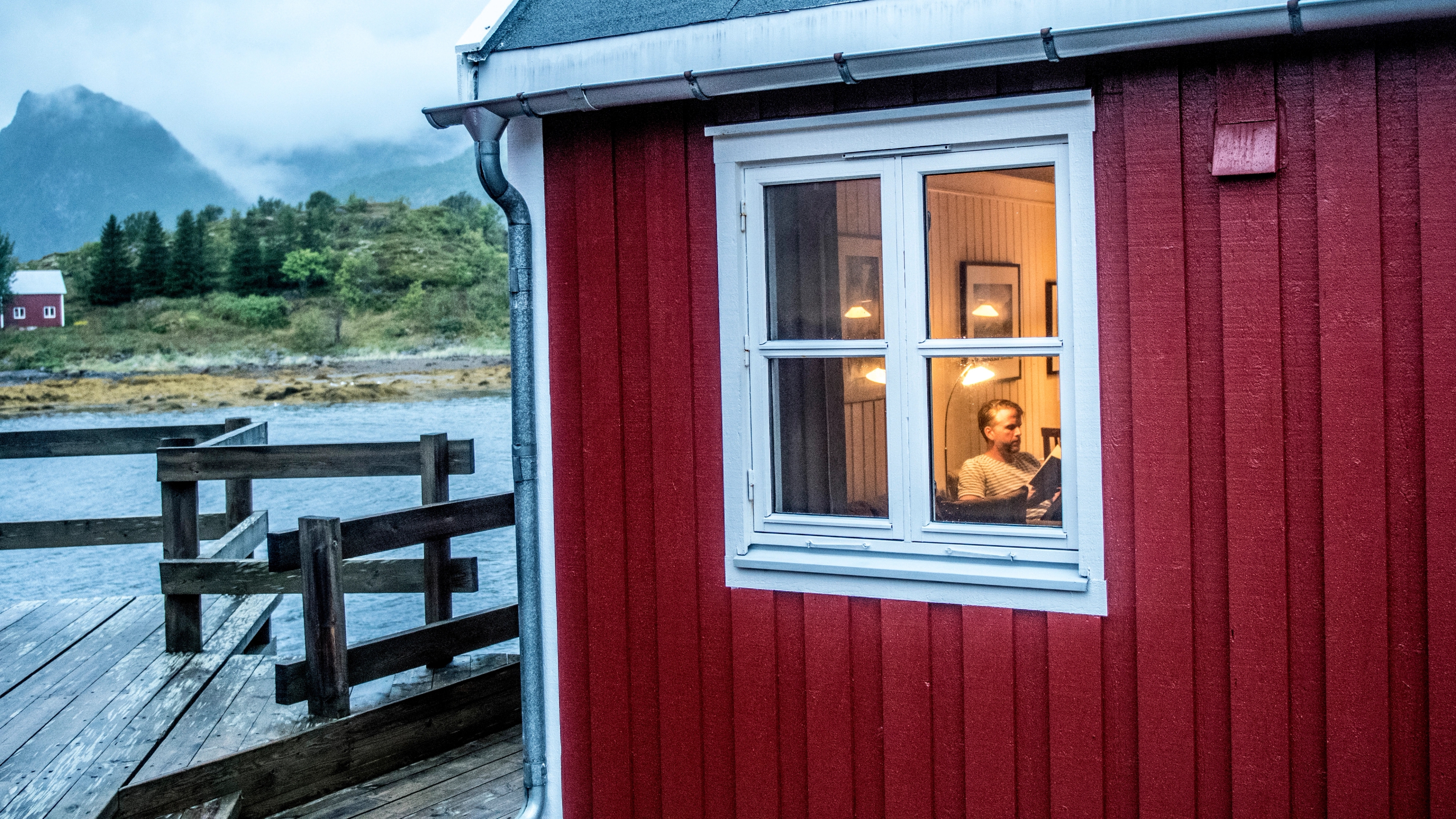 A man sitting in a fisherman's cabin in Lofoten, Northern Norway