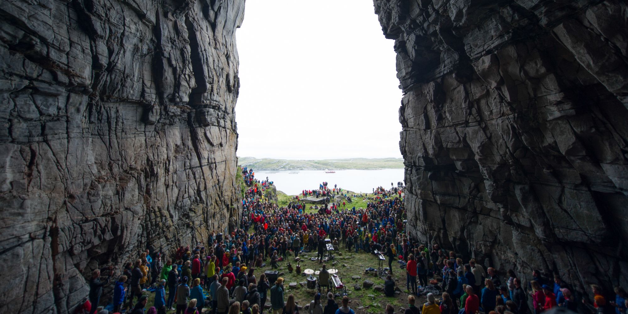 A view at the Træna festival in Helgeland seen through the mountain Kirkhellern