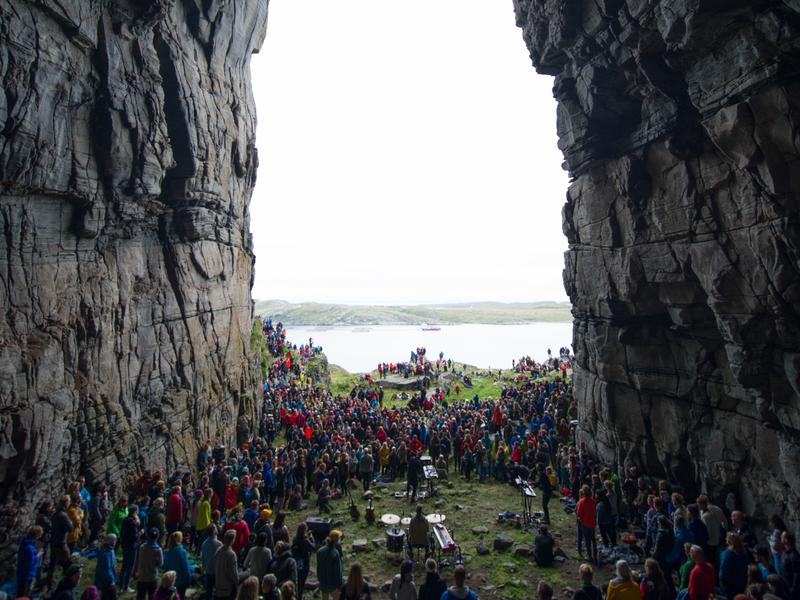 A view at the Træna festival in Helgeland seen through the mountain Kirkhellern