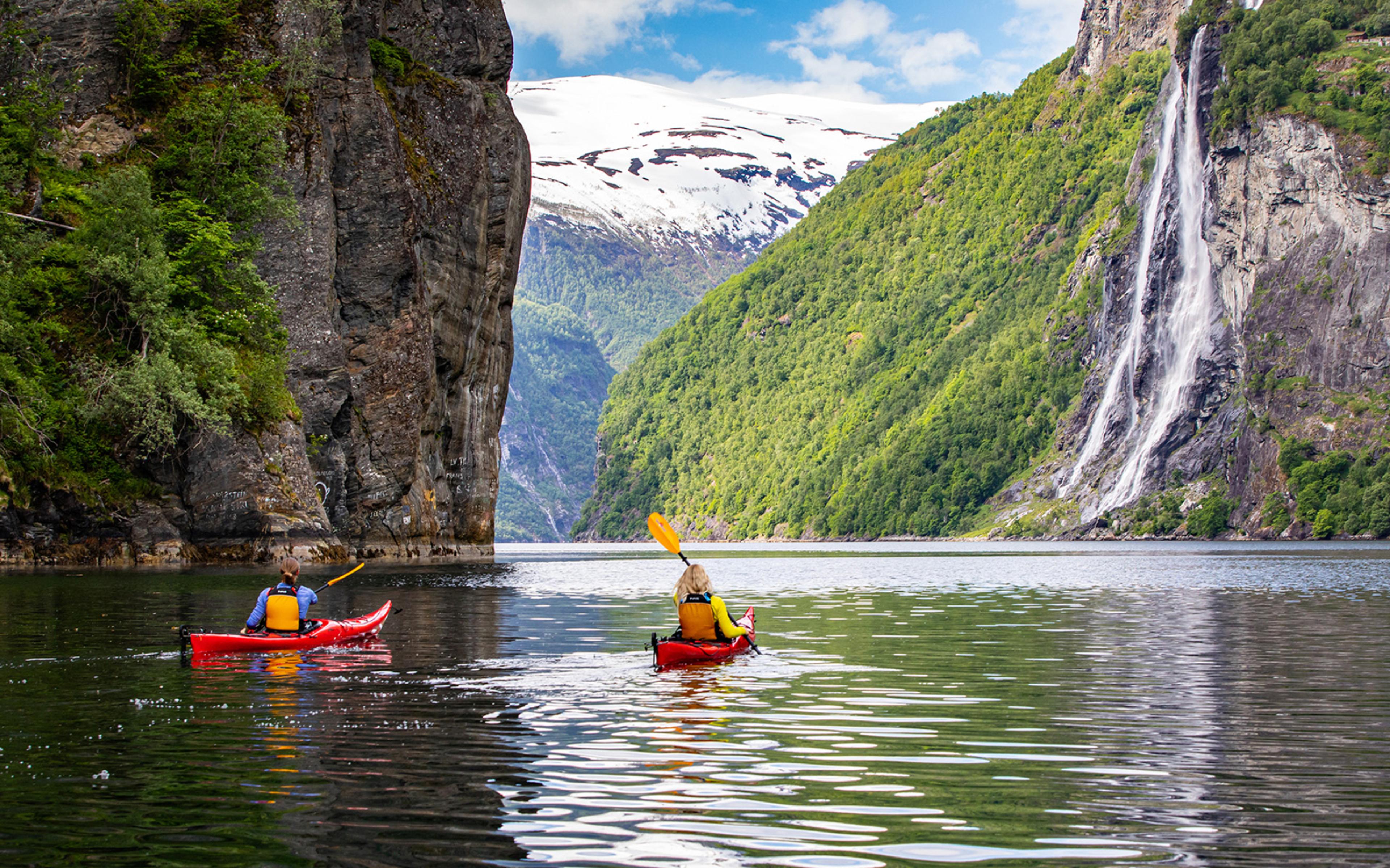 Couple kayaking on the Geiranger fjord
