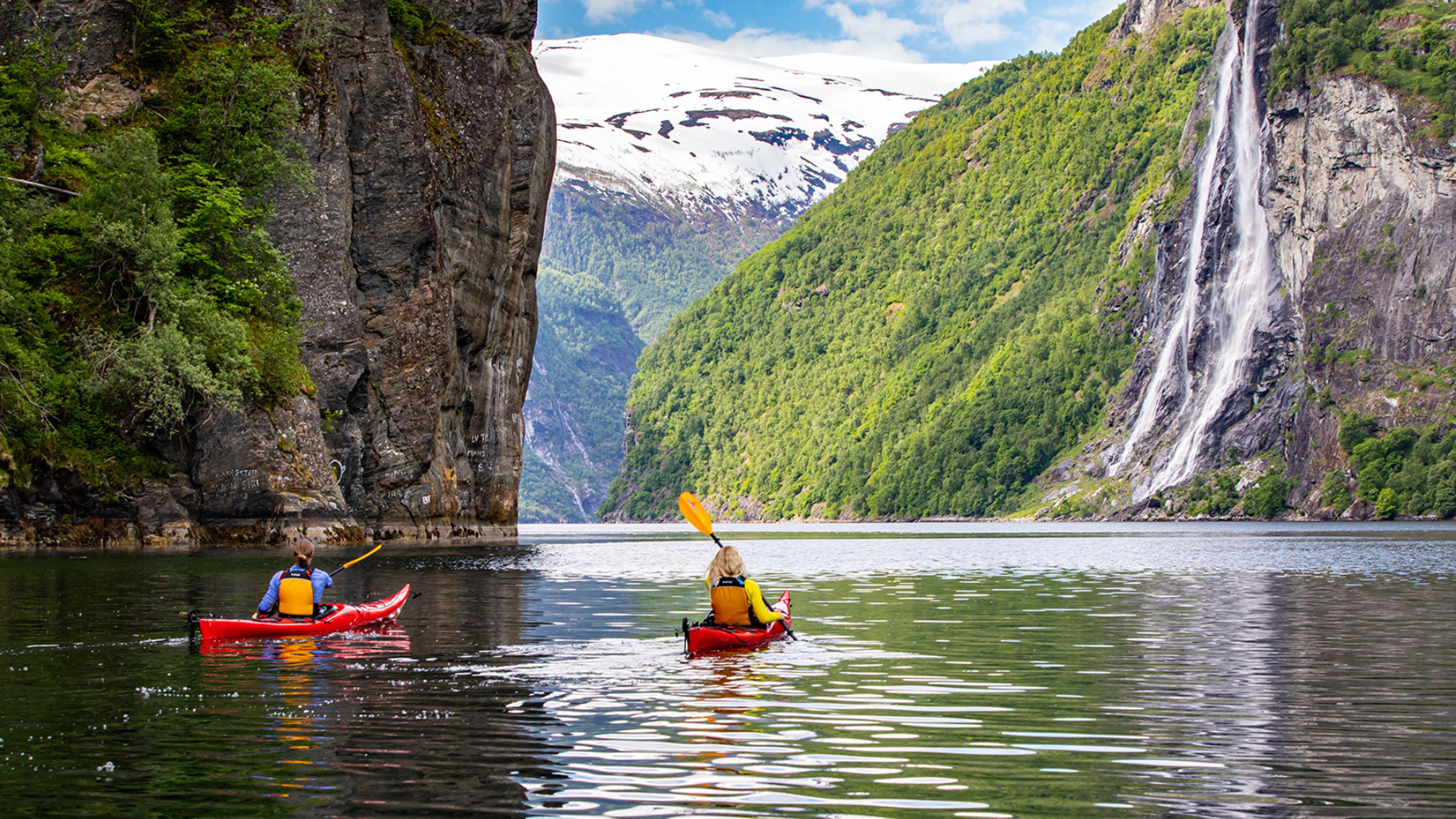 Couple kayaking on the Geiranger fjord