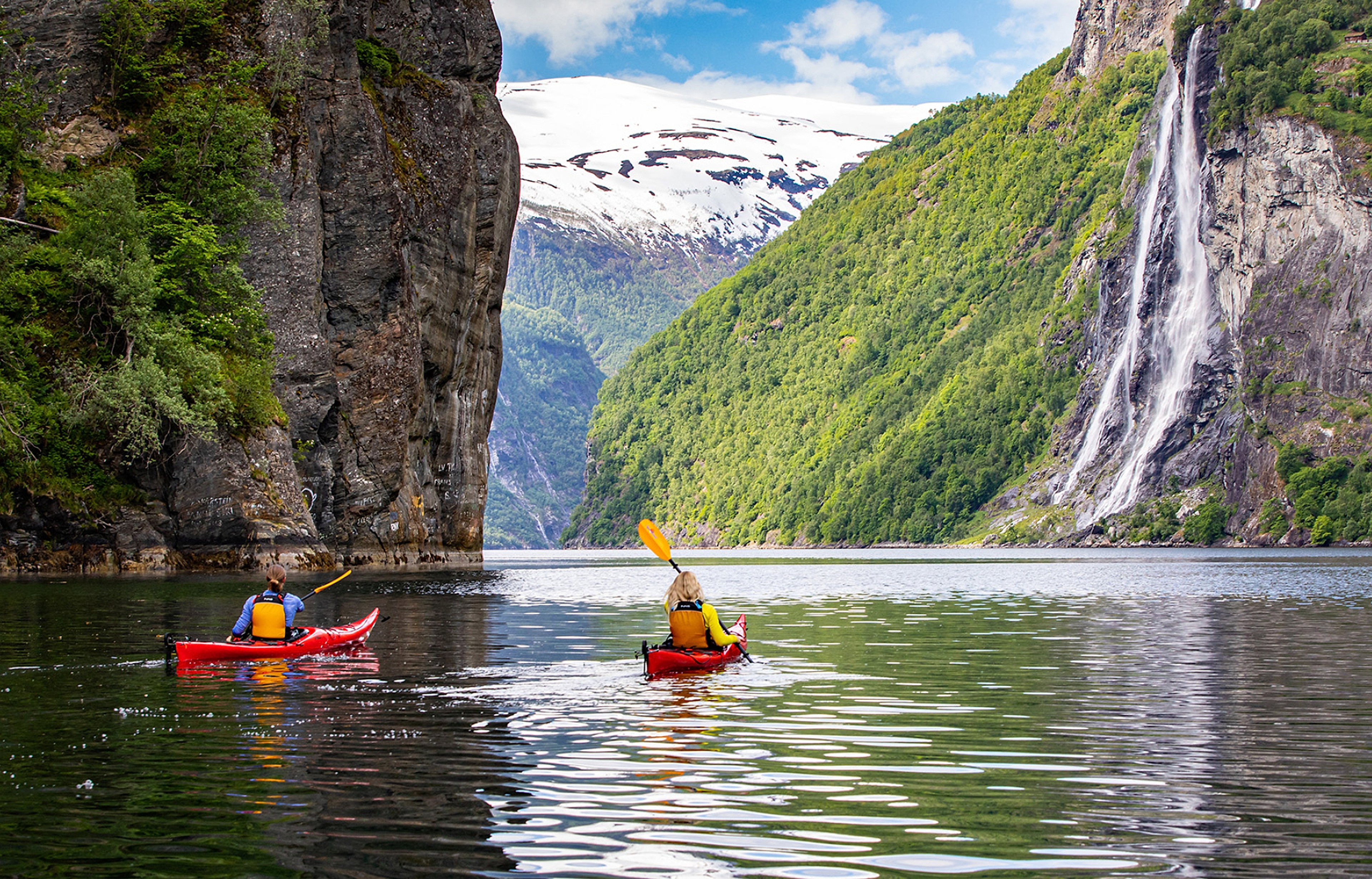 Couple kayaking on the Geiranger fjord