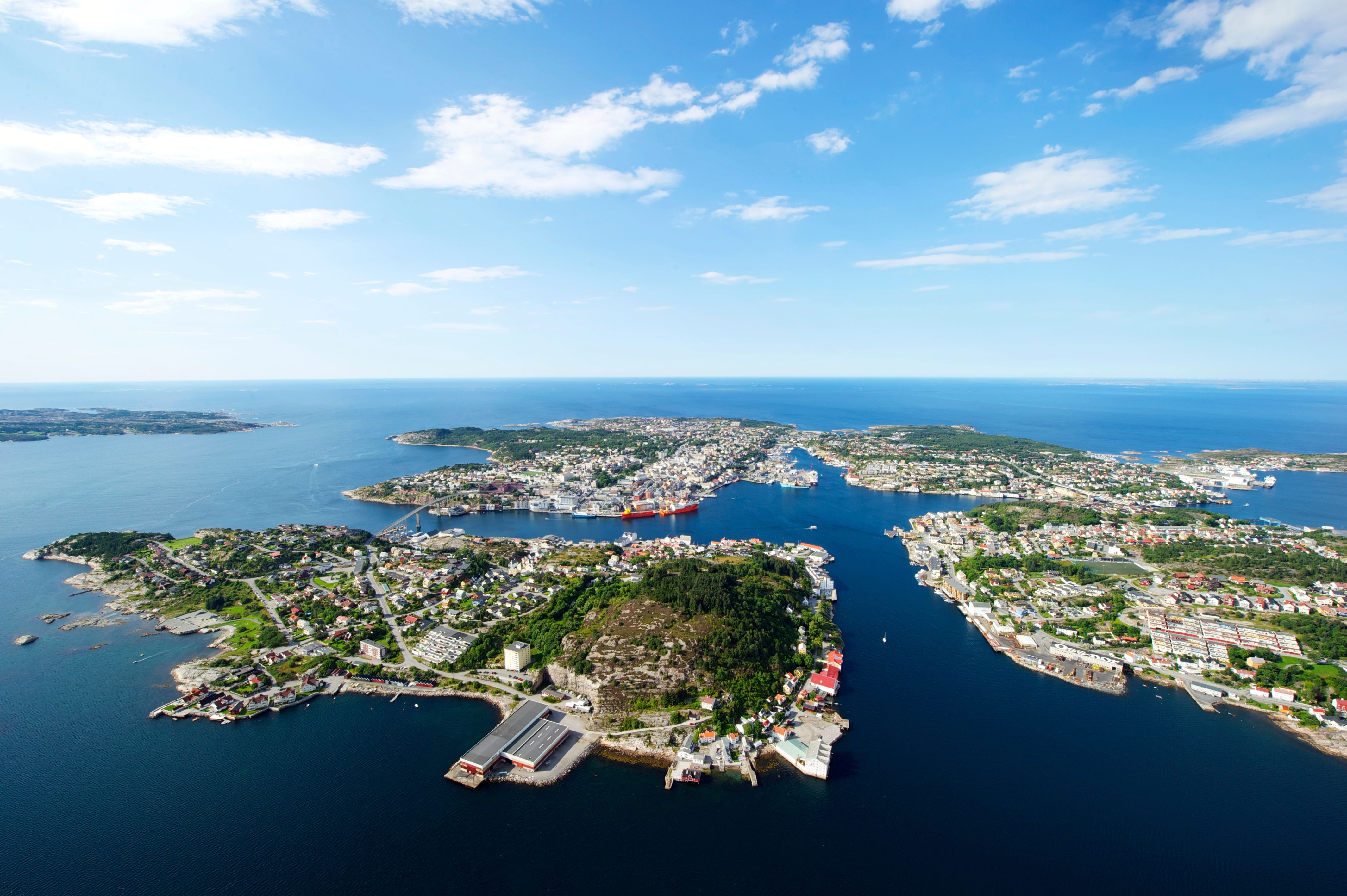 Overview of the city Kristiansund in Fjord Norway from above in the sunshine.