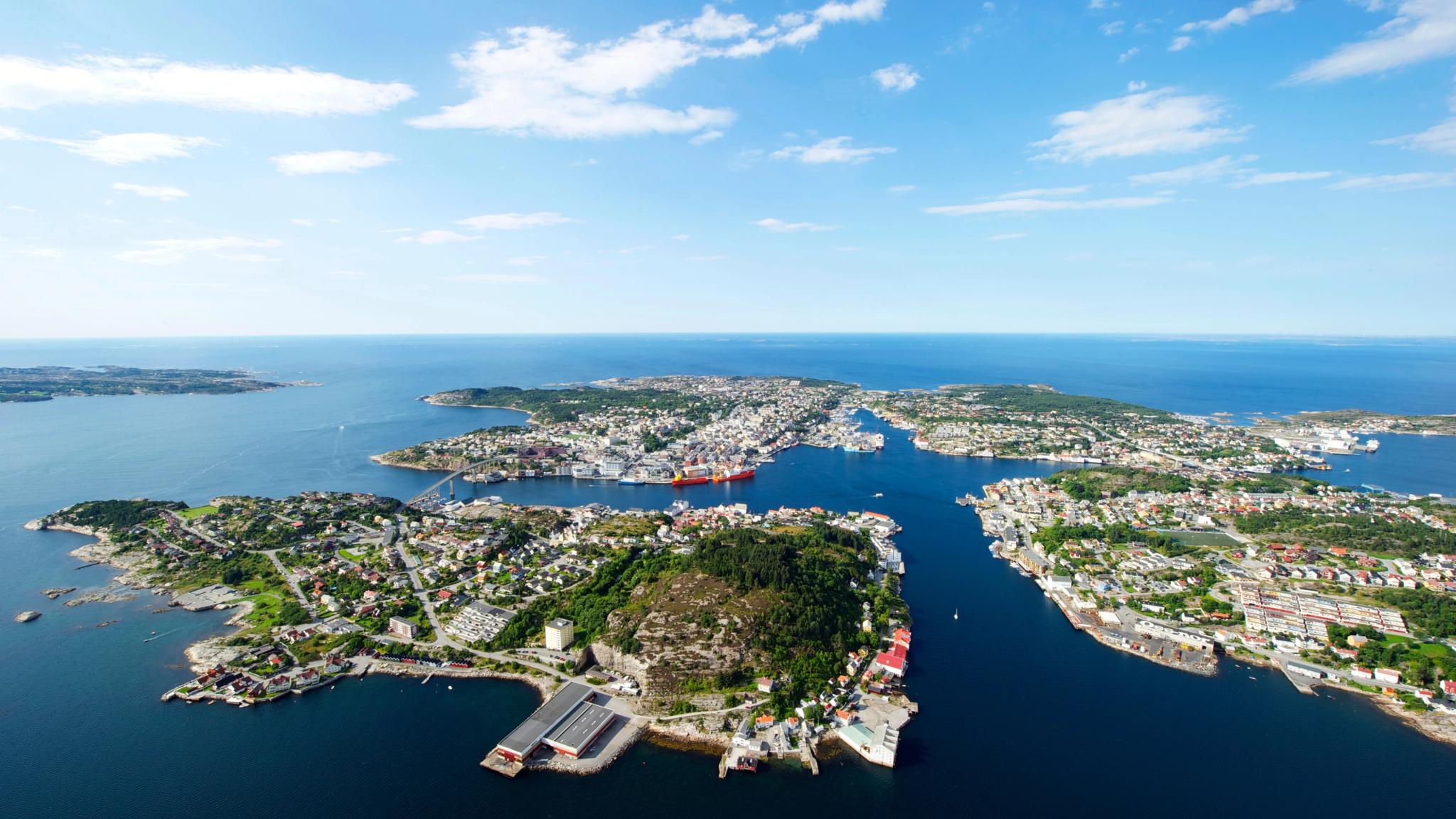 Overview of the city Kristiansund in Fjord Norway from above in the sunshine.