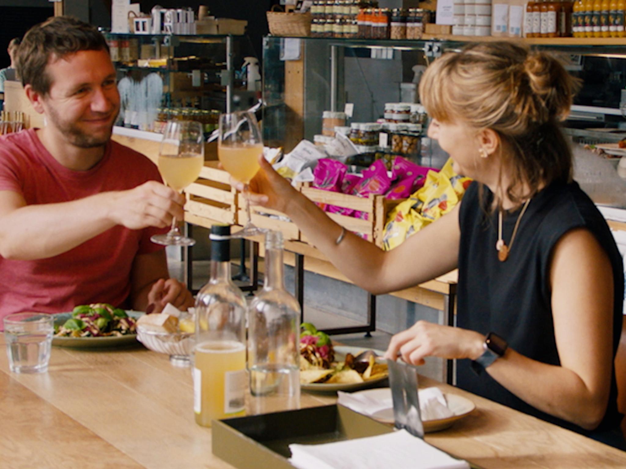 A couple toasting at restaurant in Stavanger