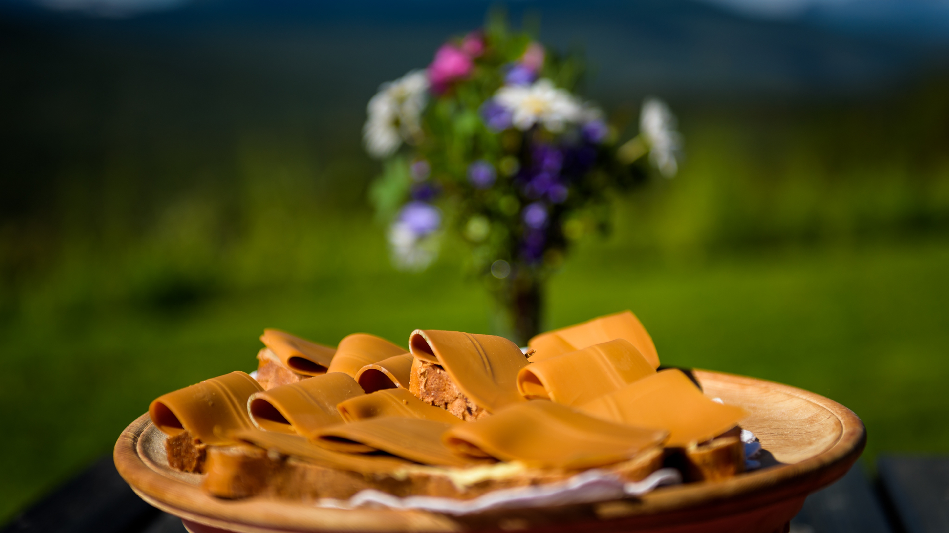 A plate with bread and brown cheese, locally produced in Lillehammer in Eastern Norway