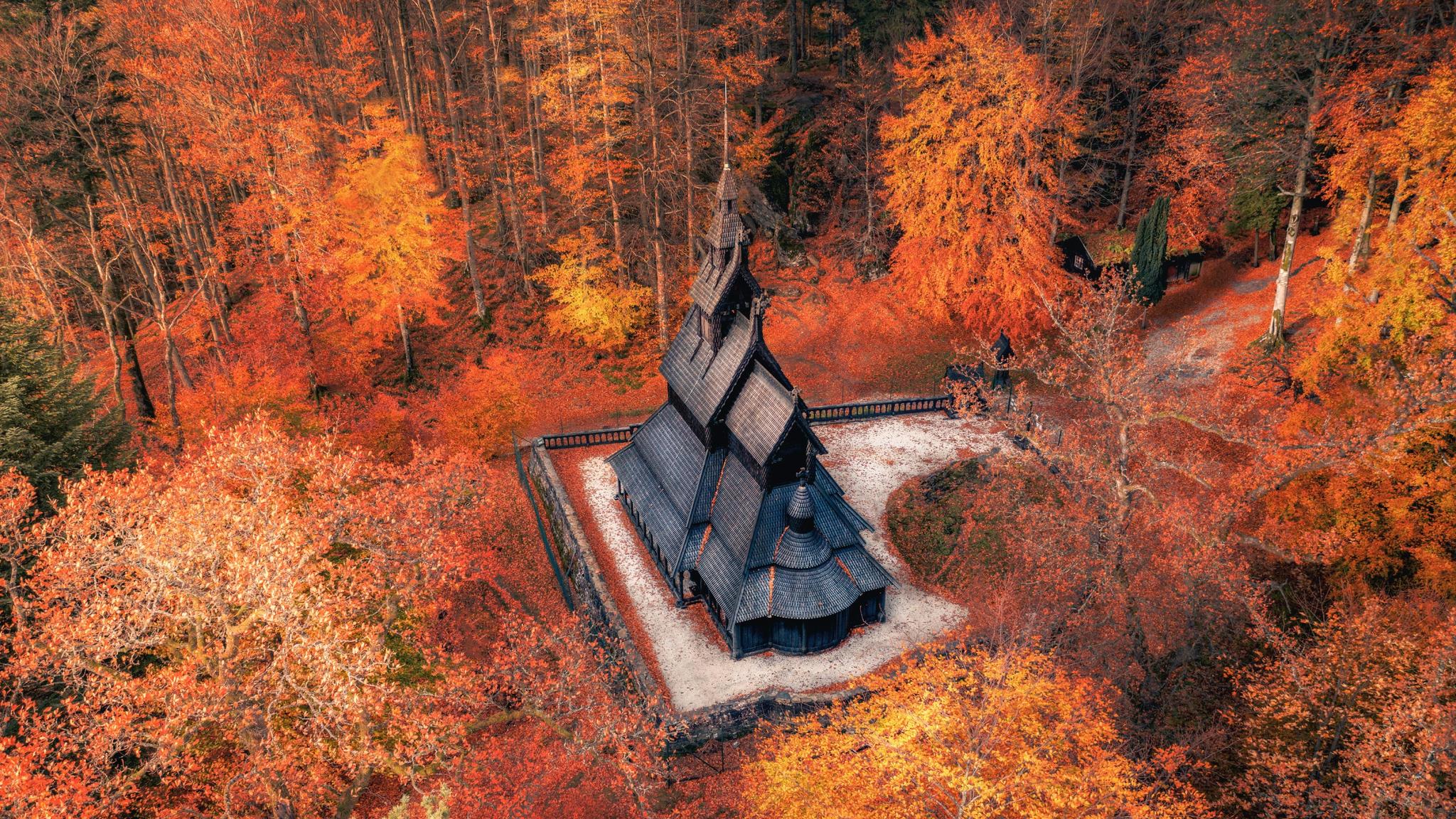The Fantoft stave church surrounded by autumn colors in Bergen in Fjord Norway