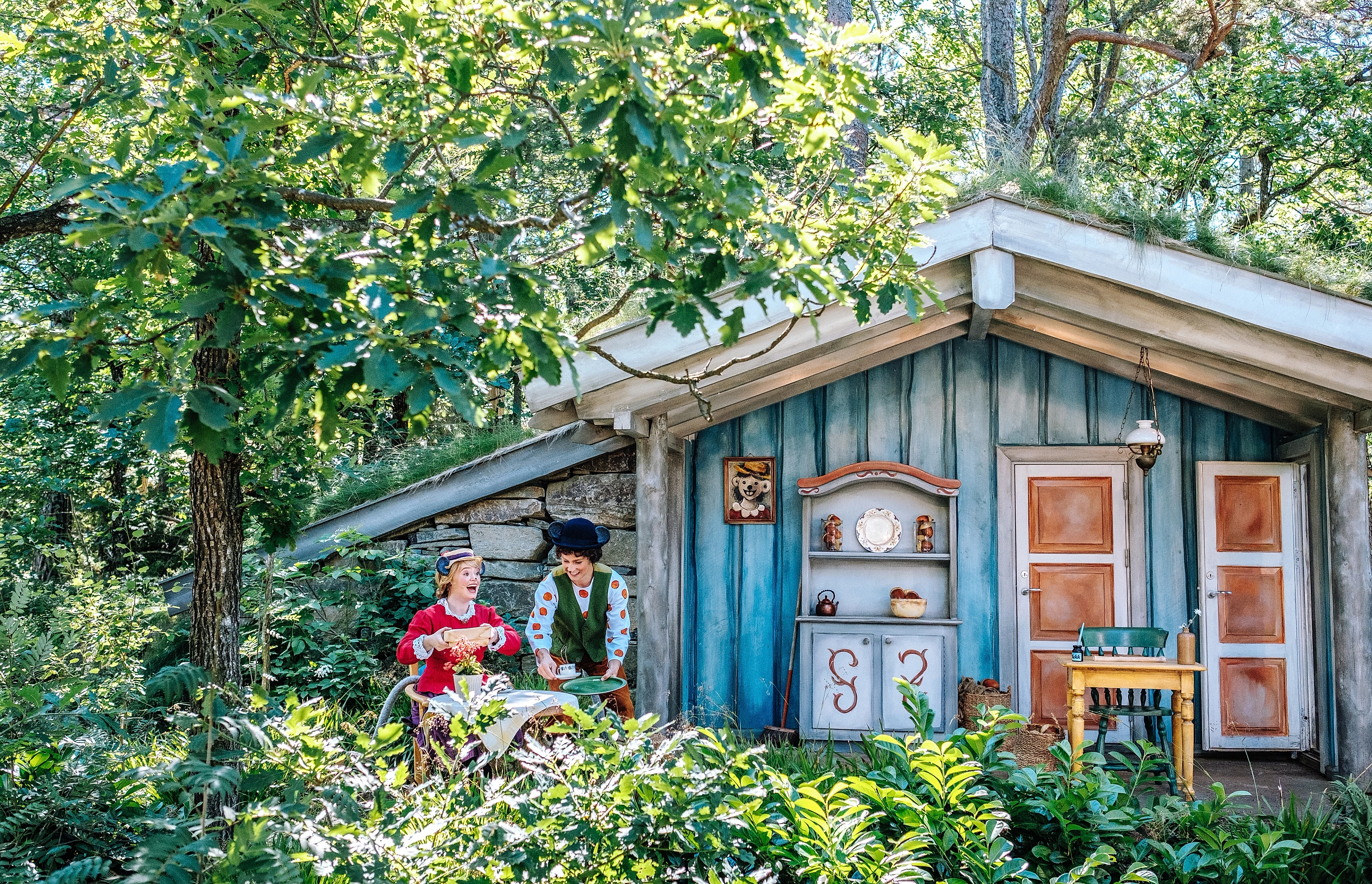 Two actors performing a scene from the Huckybucky forest in Kristiansand zoo and amusement park, Southern Norway.