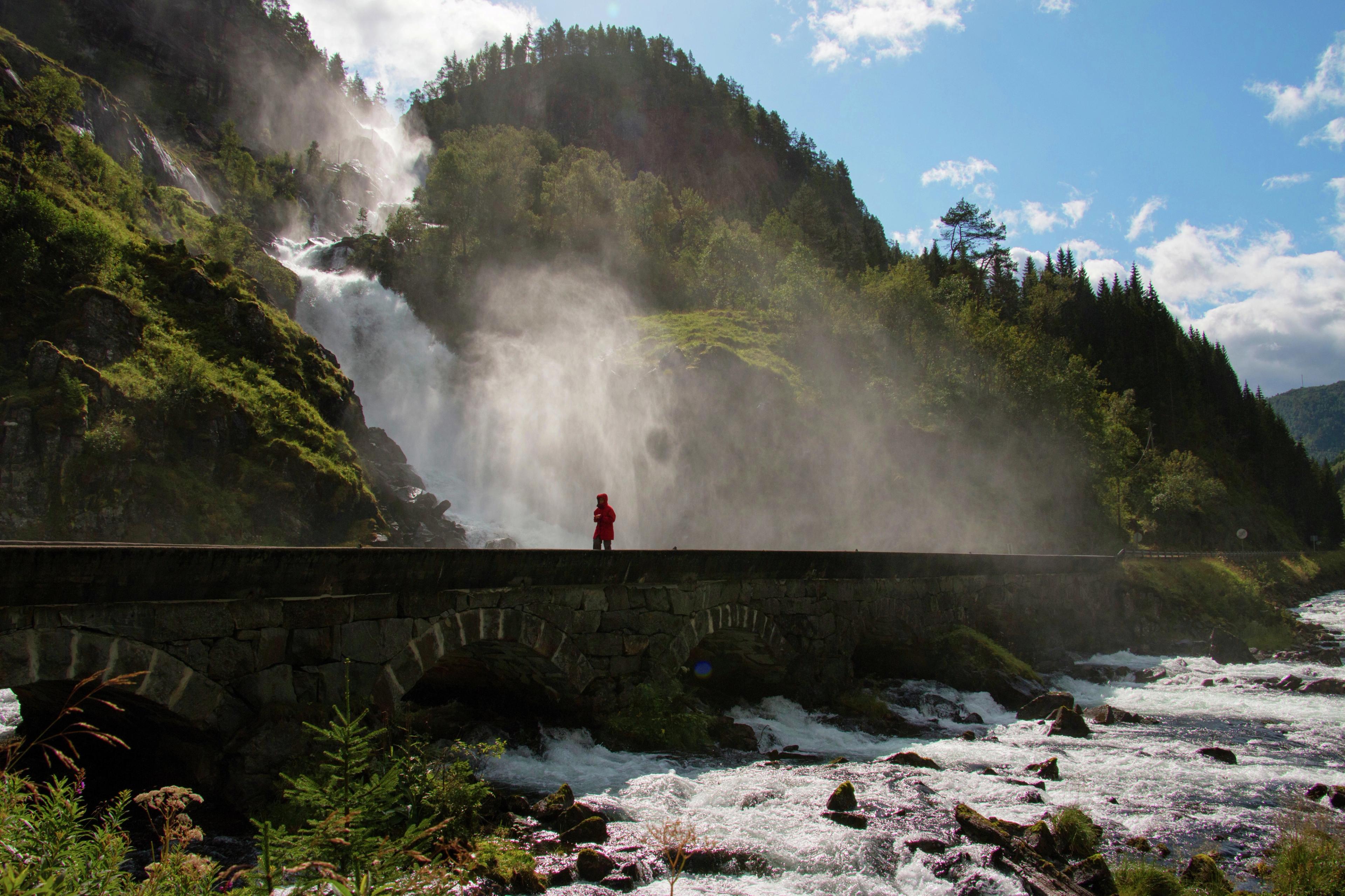 Someone walking by Låtefossen in Fjord Norway