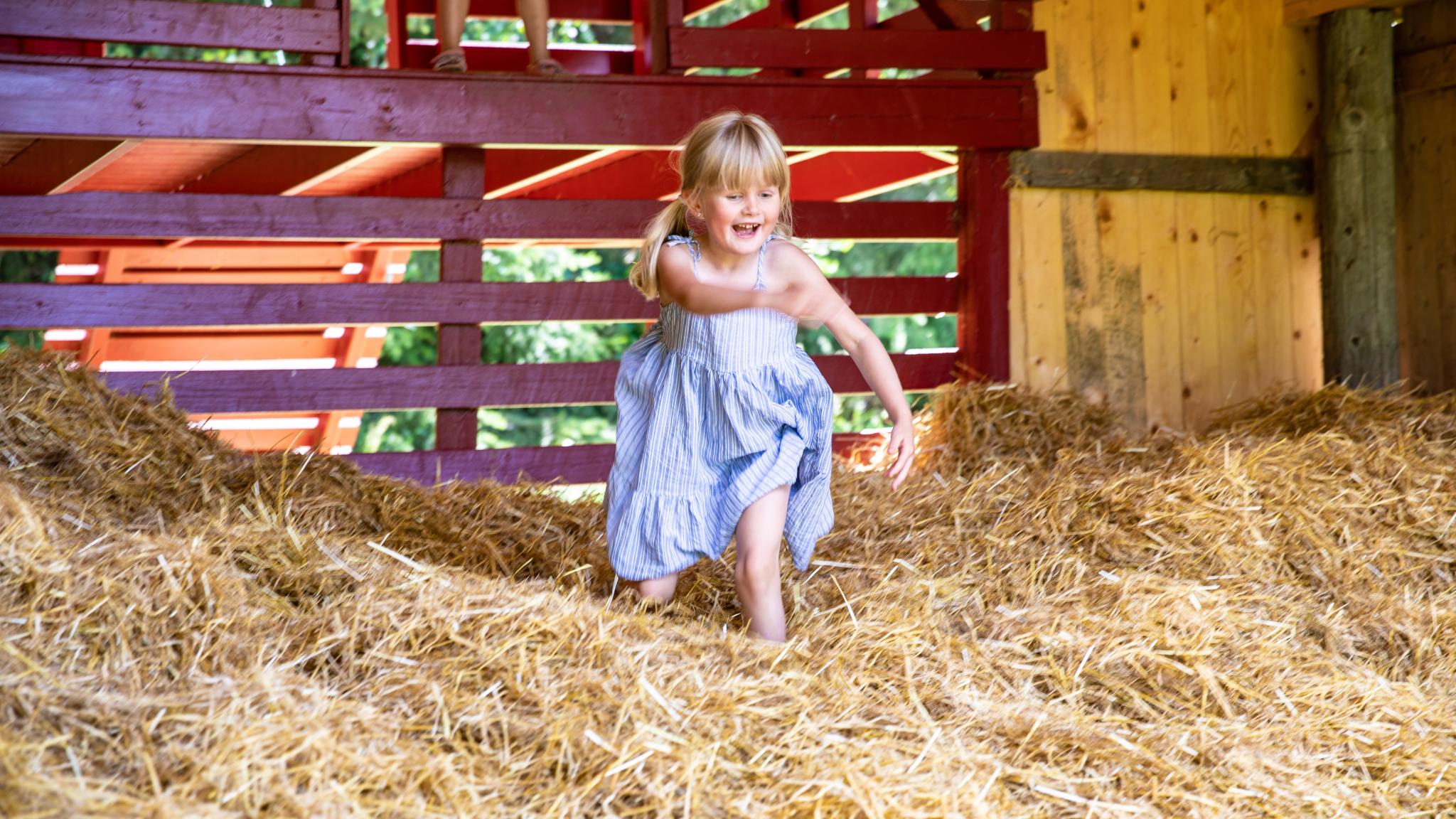 Girl playing in Snilsberg Family park, Ringsaker, Eastern Norway