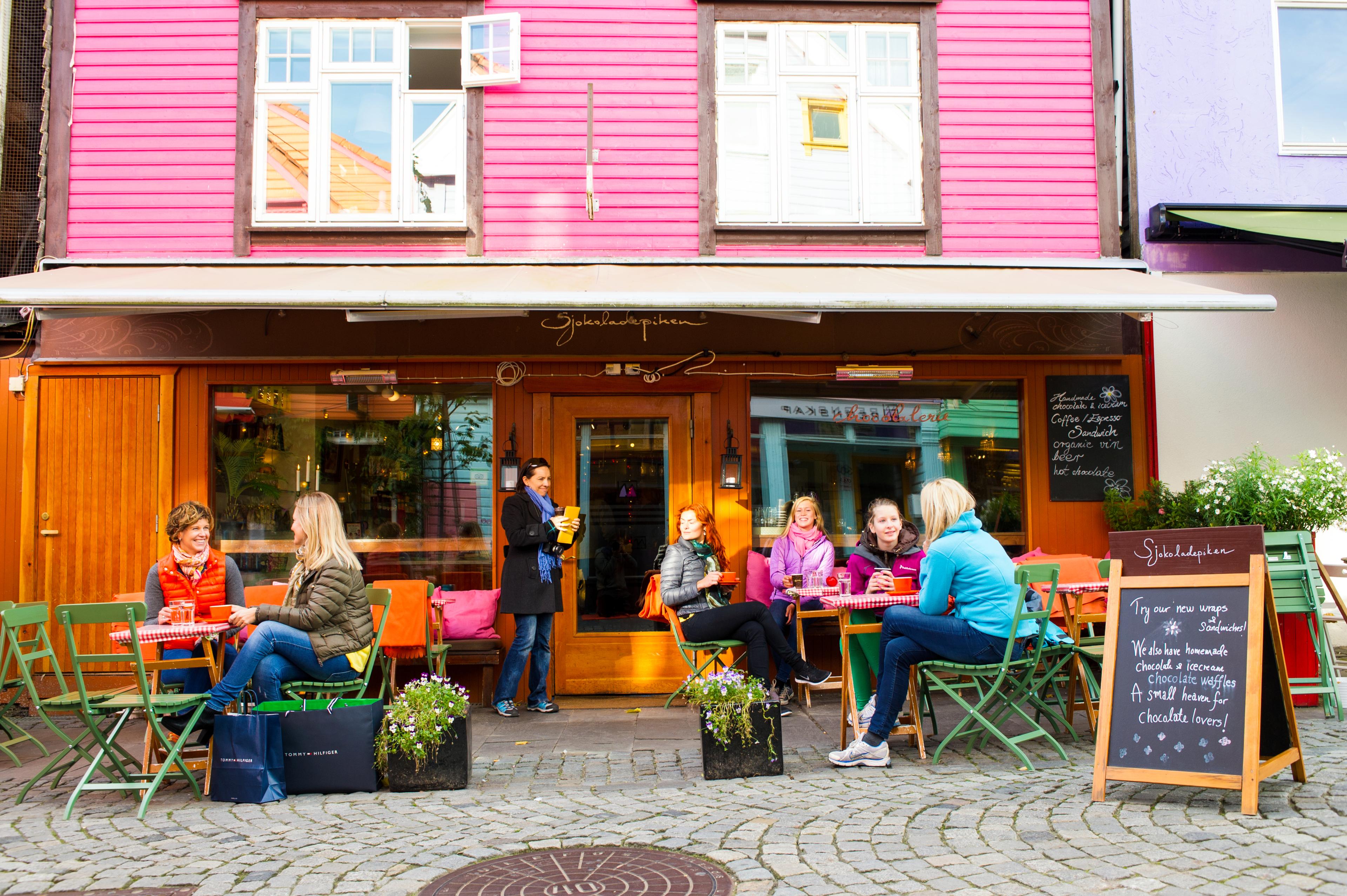 People enjoying food at the Sjokoladepiken café in Stavanger, Rogaland, Norway.
