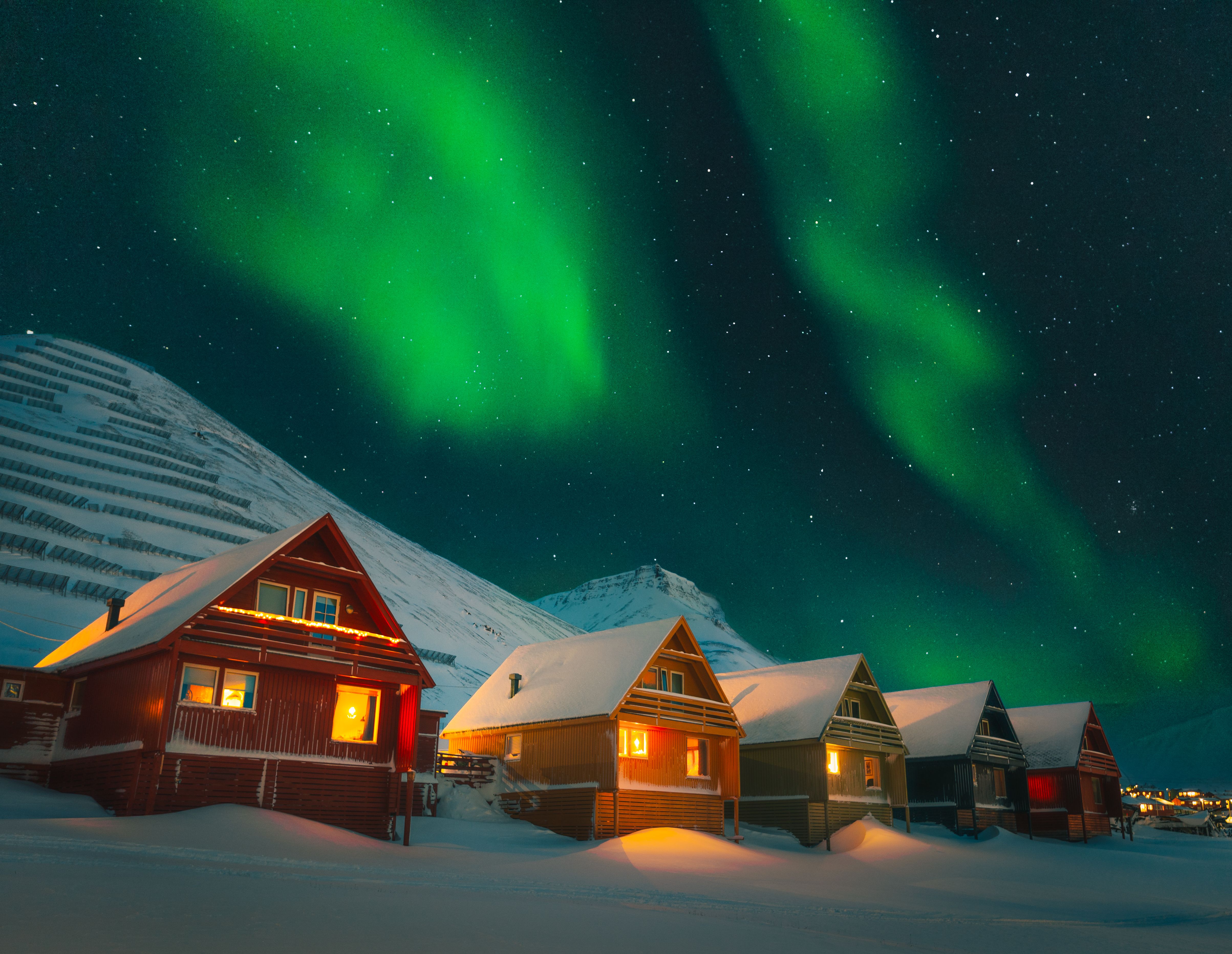 Colorful houses of Longyearbyen under the northern lights