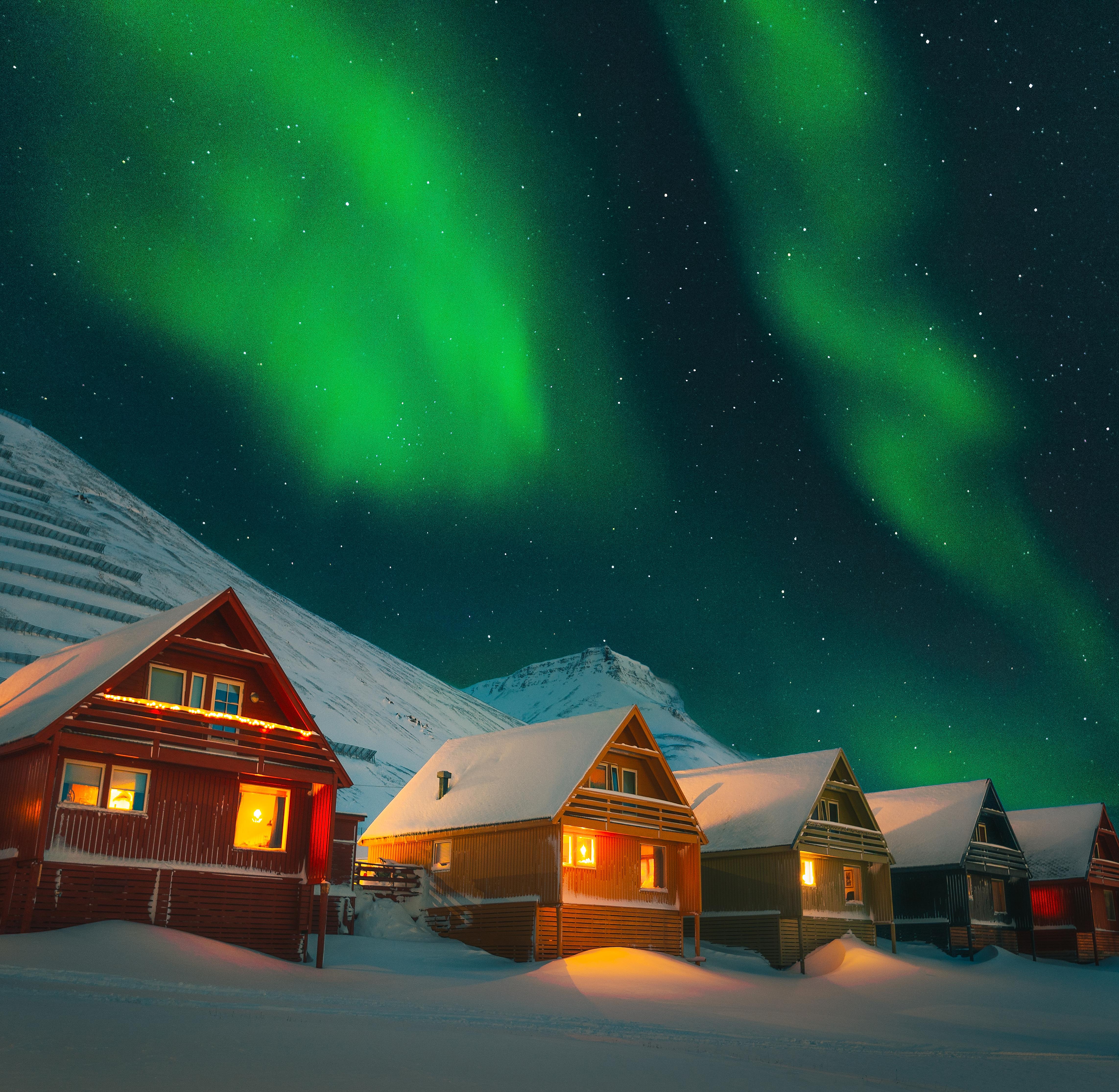 Colorful houses of Longyearbyen under the northern lights