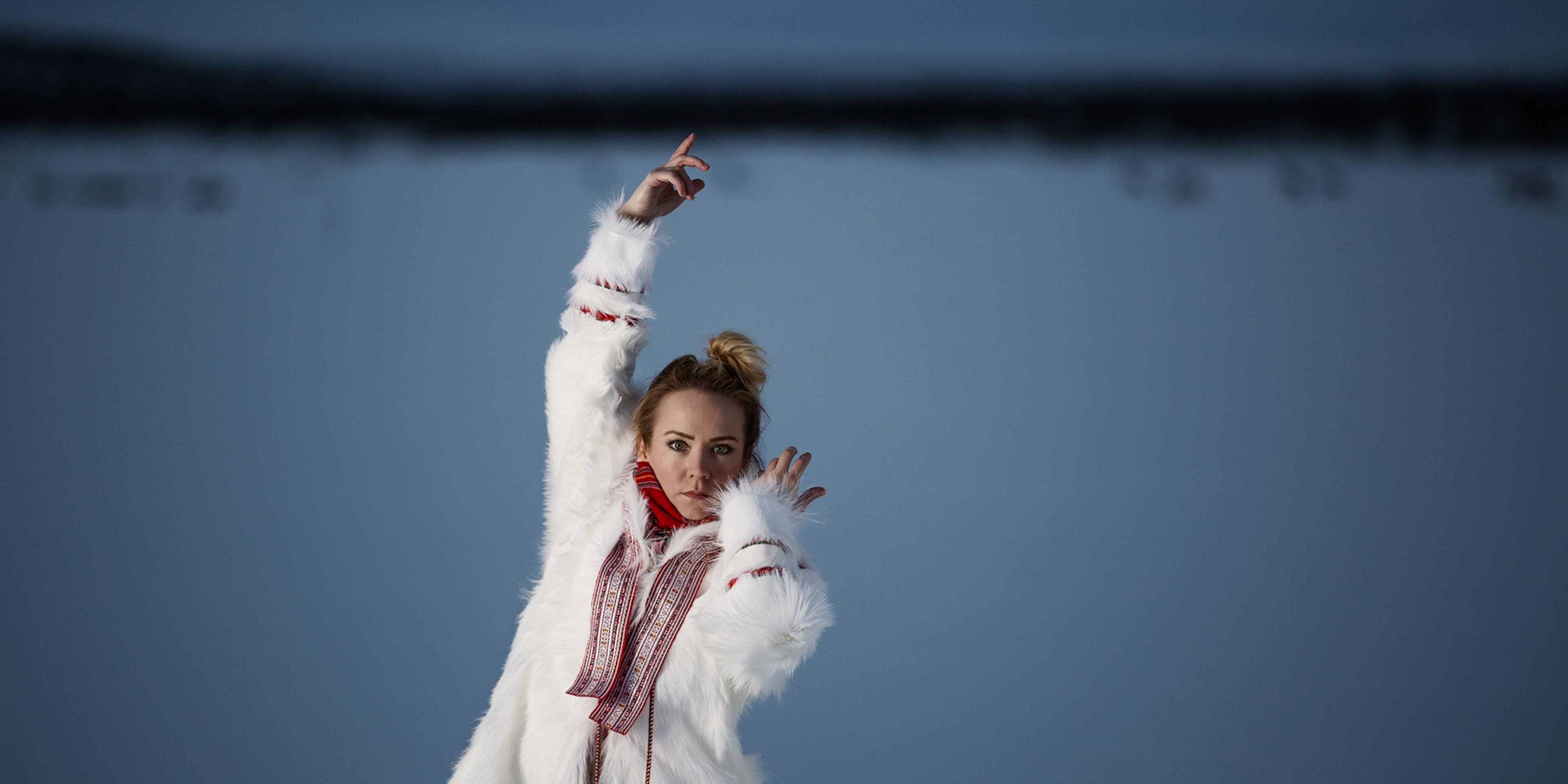 The rebirth of the joik: portrait photo of the Sami artist Elle Márjá Eira outside during winter in Northern Norway.