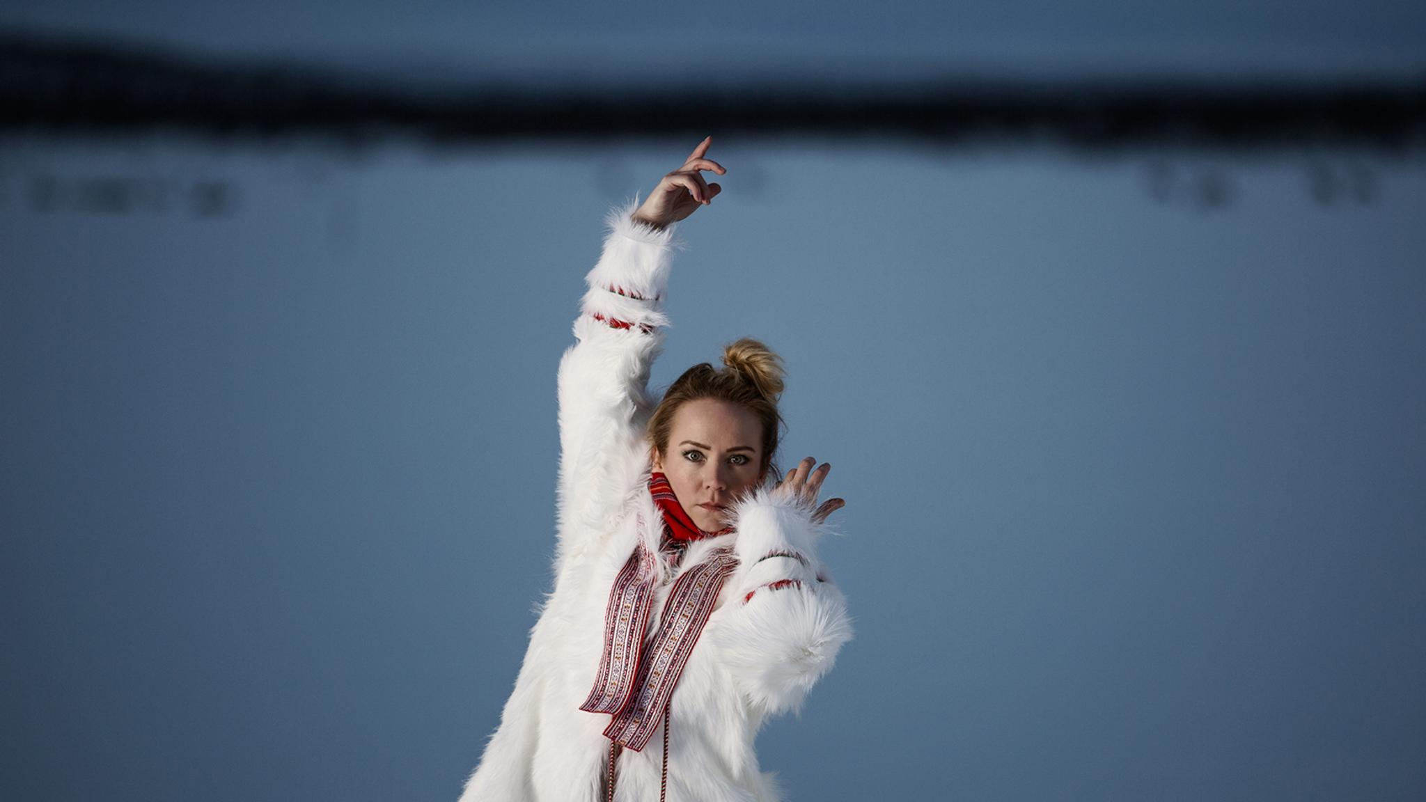 The rebirth of the joik: portrait photo of the Sami artist Elle Márjá Eira outside during winter in Northern Norway.