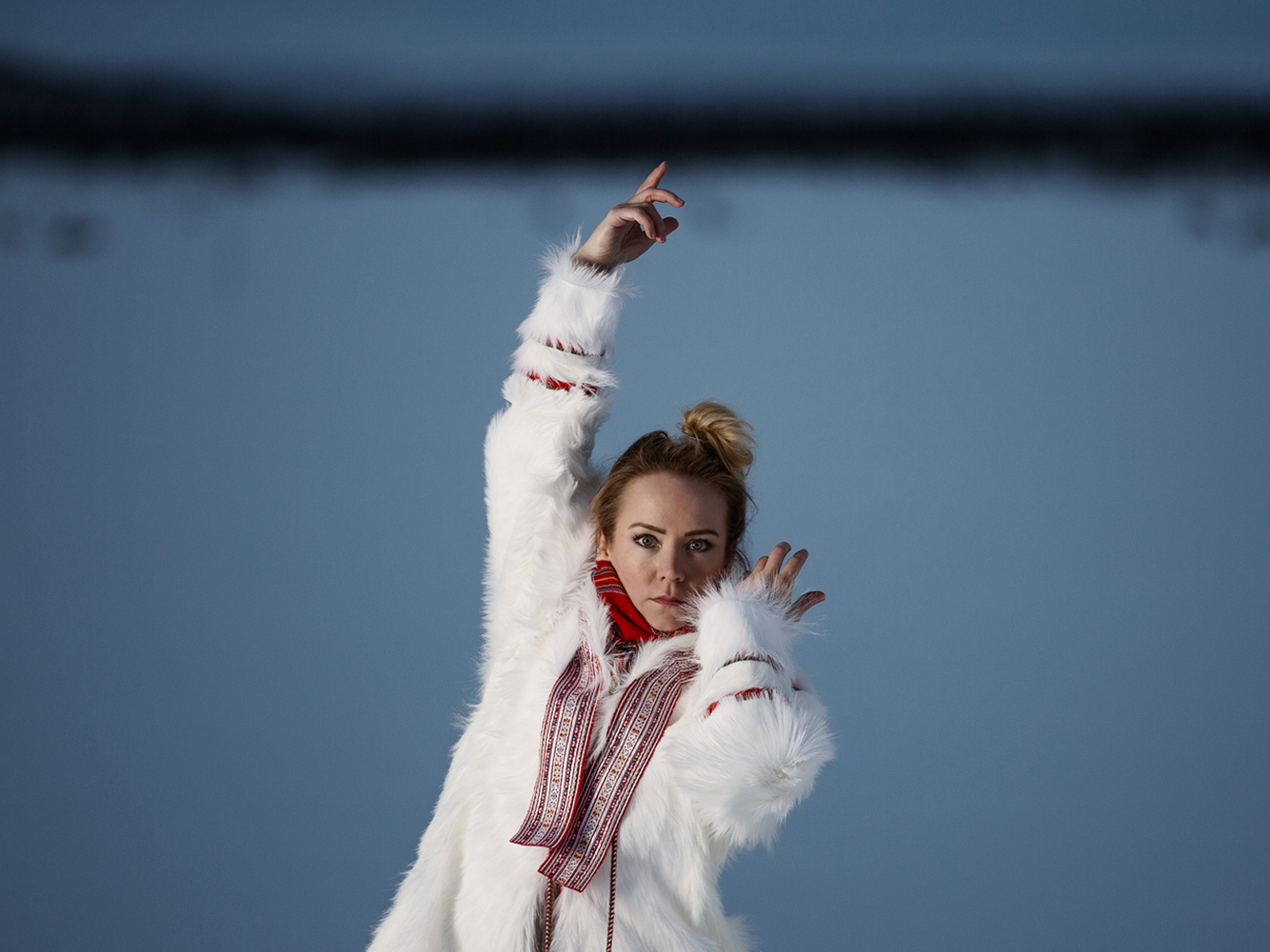 The rebirth of the joik: portrait photo of the Sami artist Elle Márjá Eira outside during winter in Northern Norway.