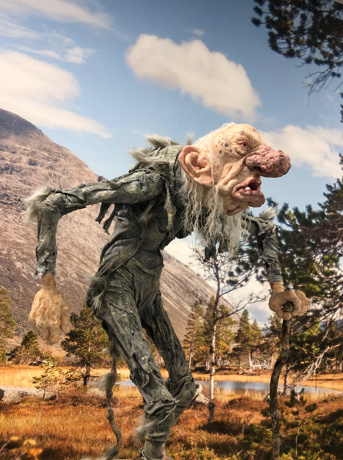 A troll walking in the forrest at the family park Home of the trolls in Rindal, Trøndelag.