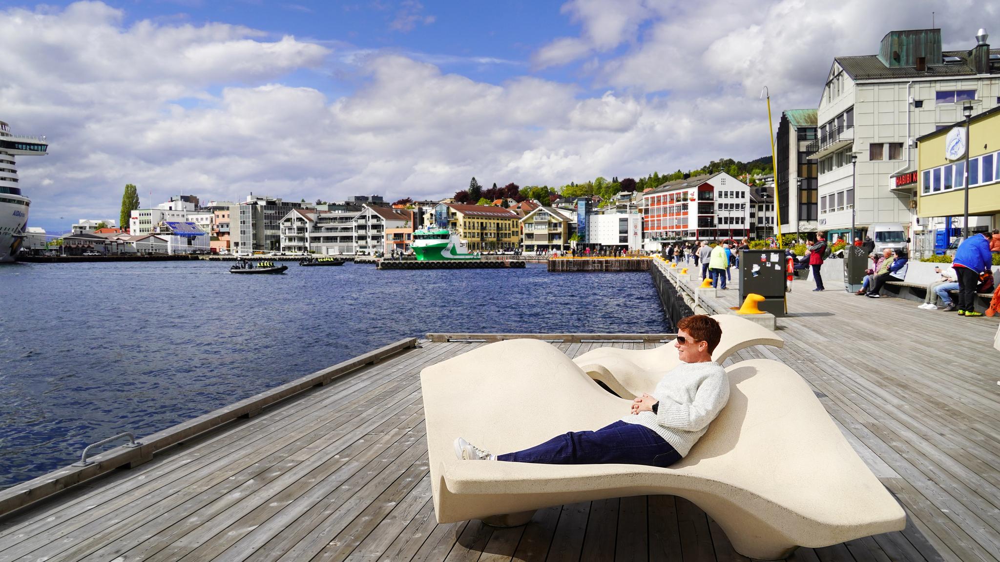 A woman sitting in a sun shair in Molde in the Northwest.