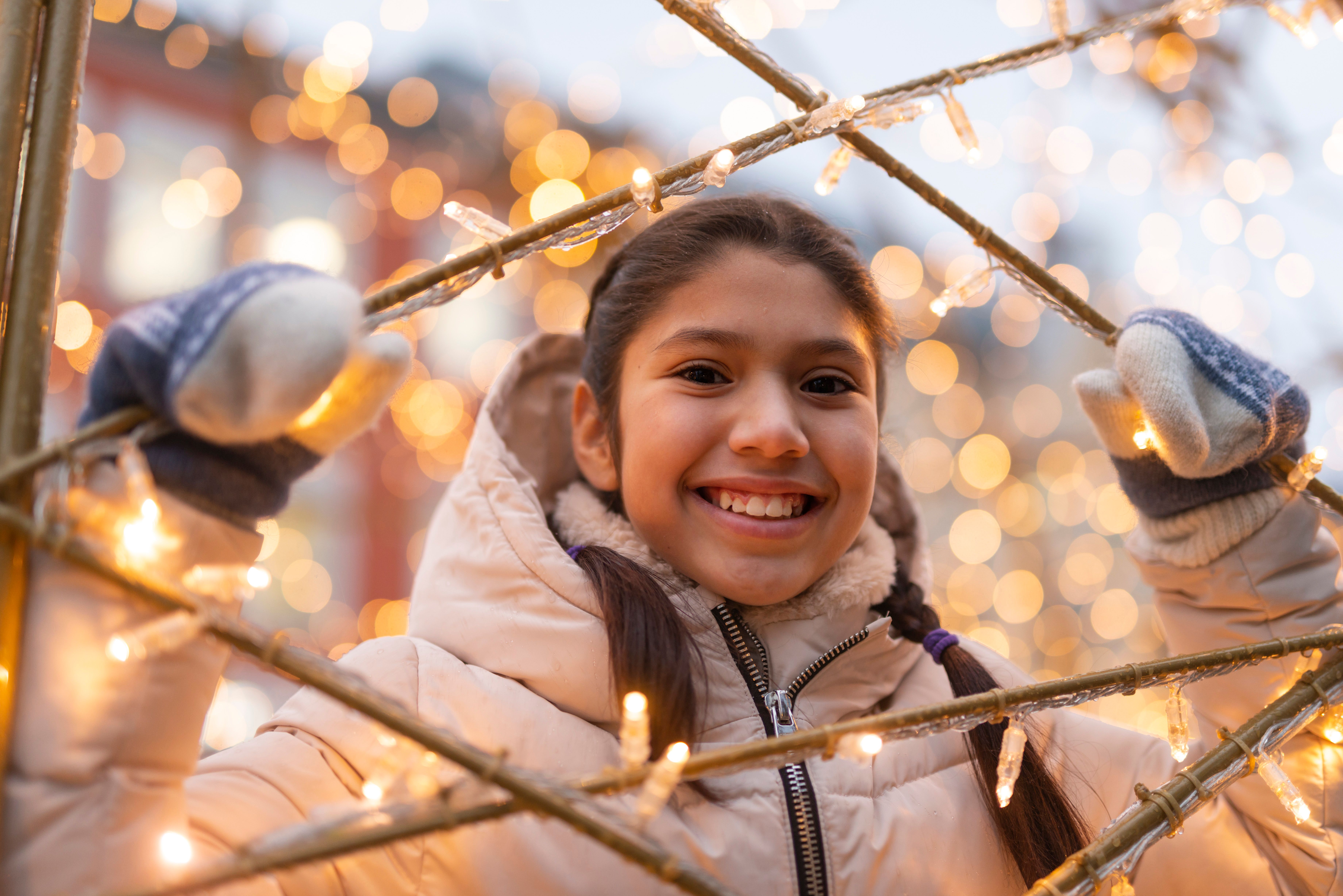 A girl smiling in Kristiansand Christmas town