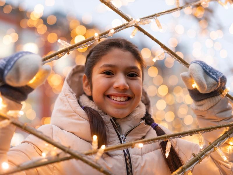 A girl smiling in Kristiansand Christmas town