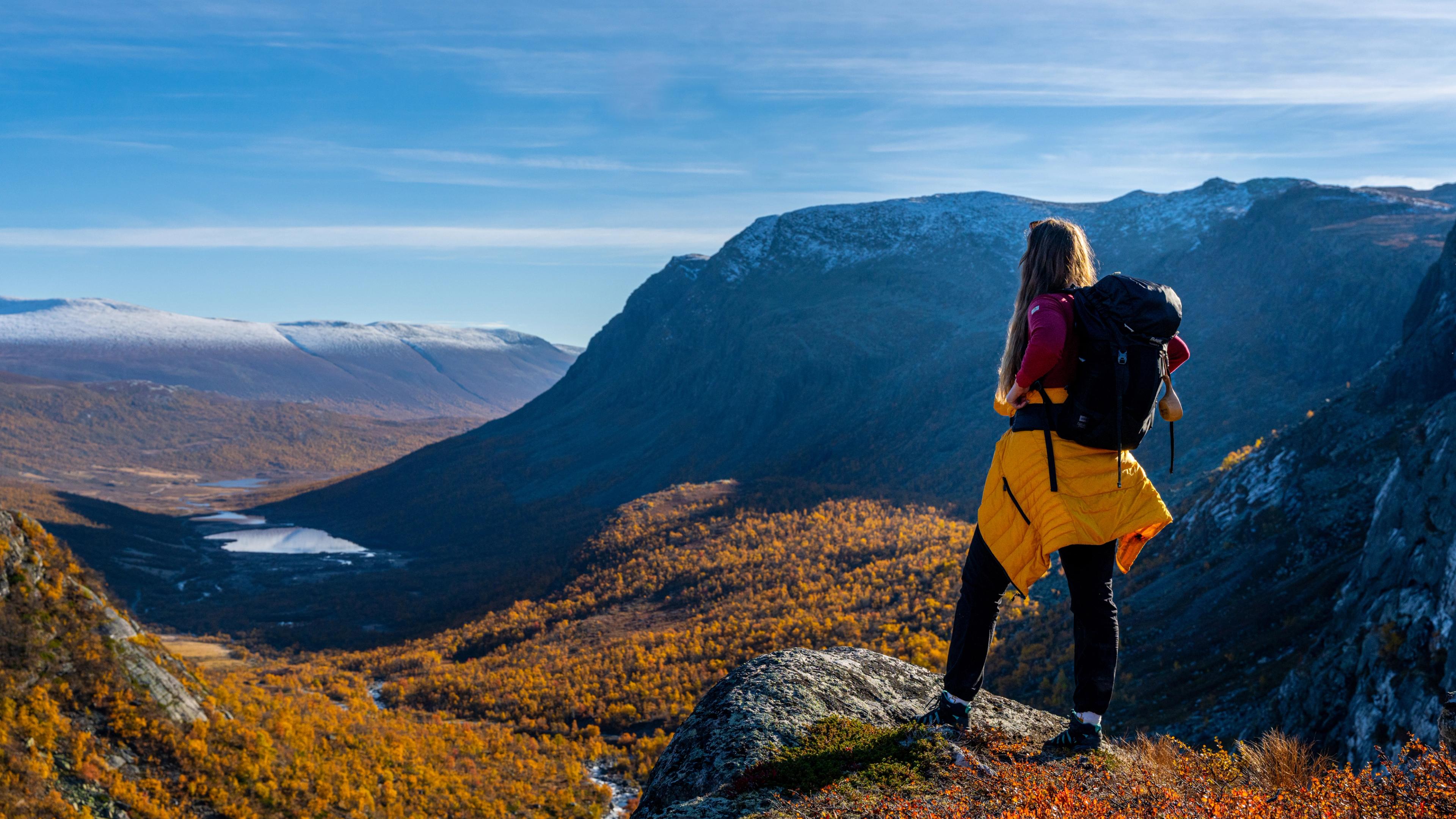 Woman enjoying the autumn view of Hydalen in Hemsedal