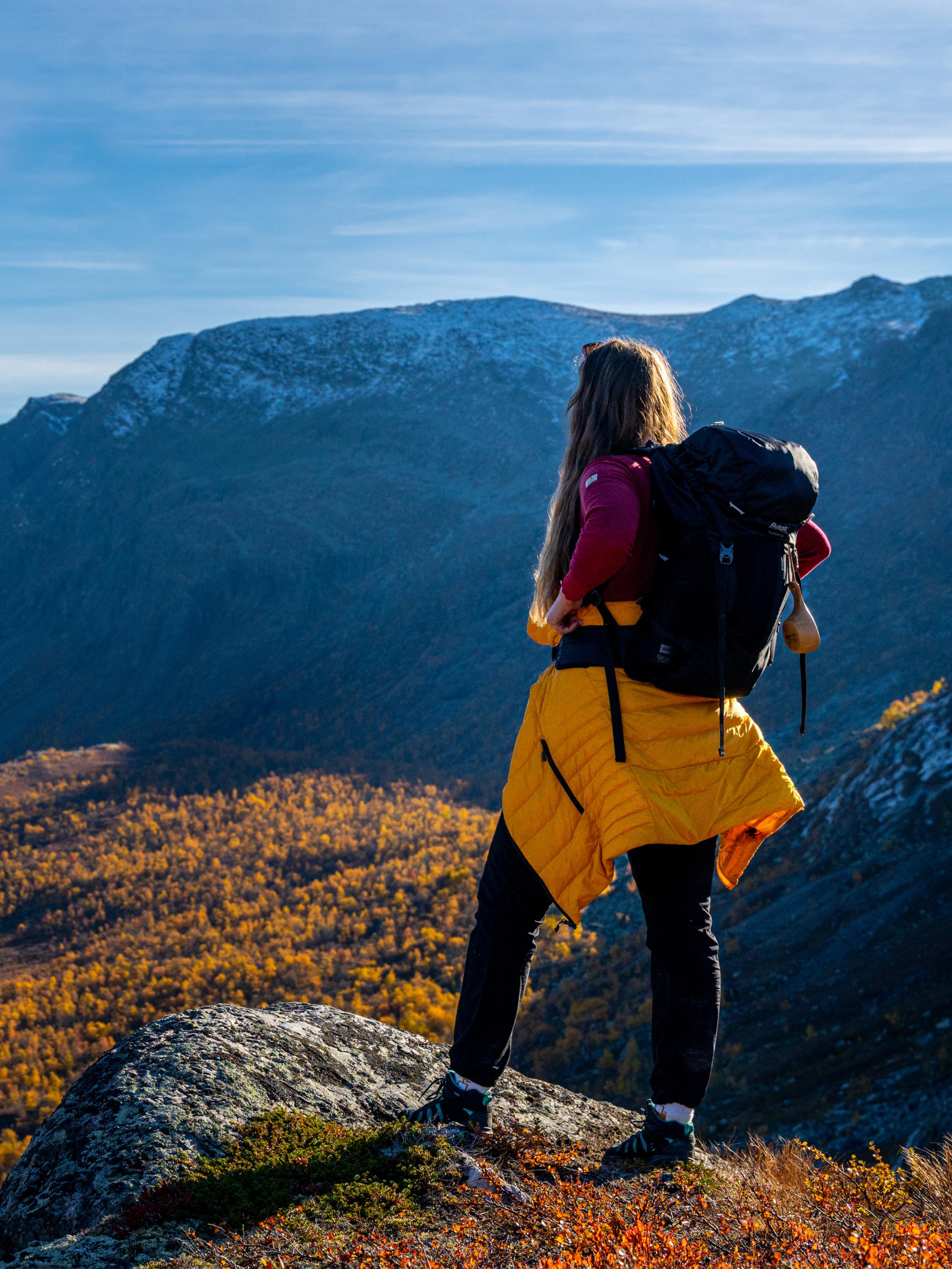 Woman enjoying the autumn view of Hydalen in Hemsedal