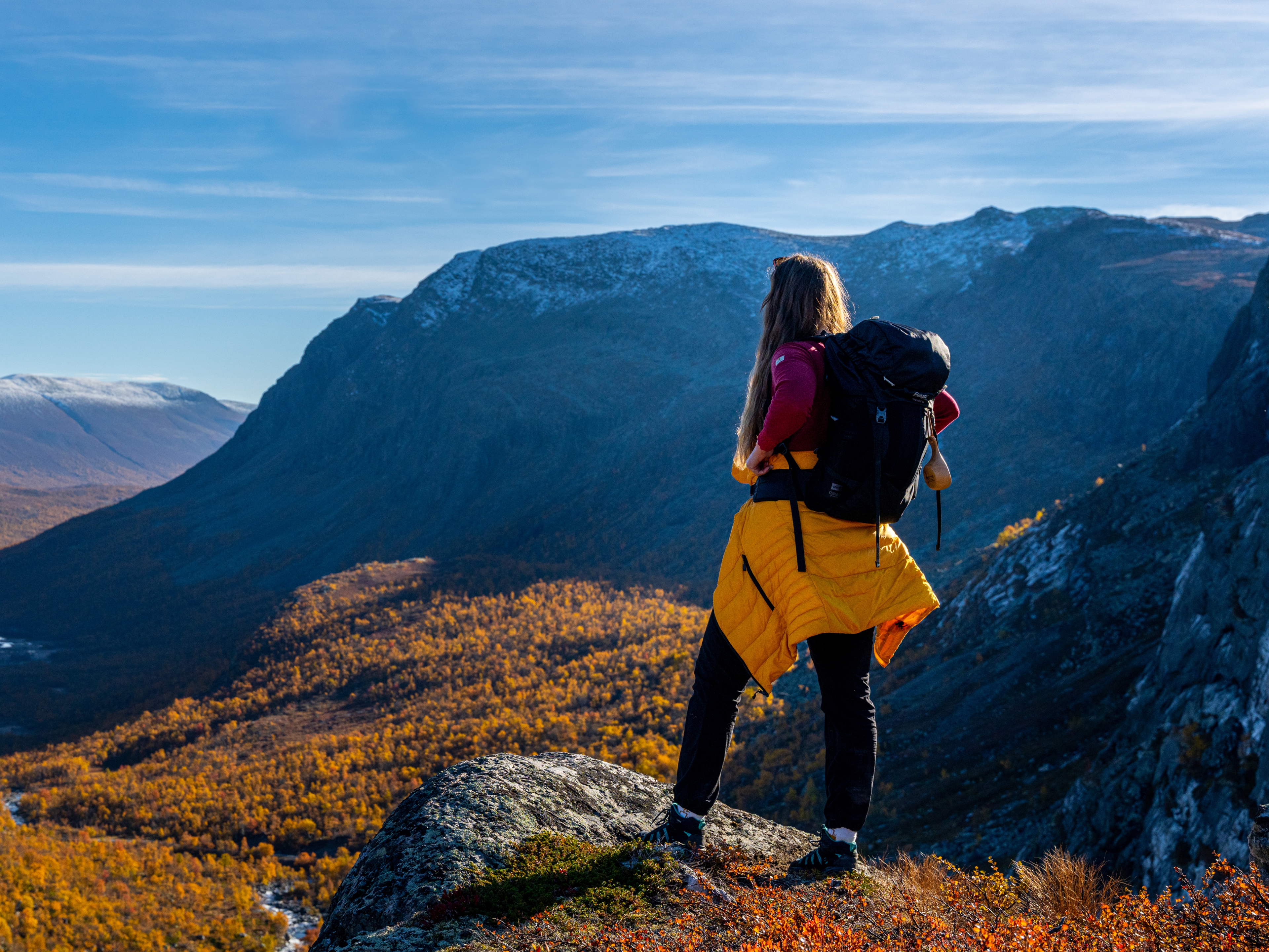 Woman enjoying the autumn view of Hydalen in Hemsedal