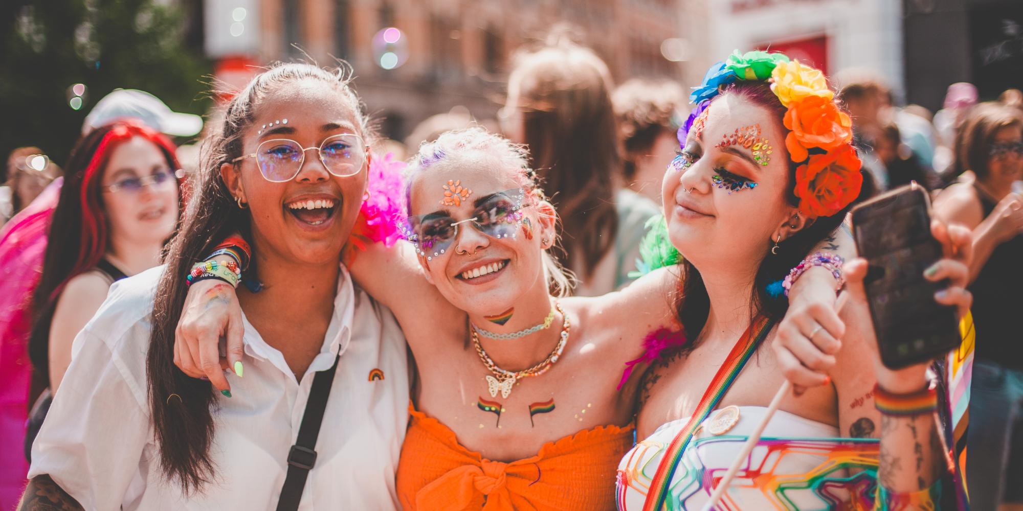 Three girls smiling in the Oslo Pride parade, 2023
