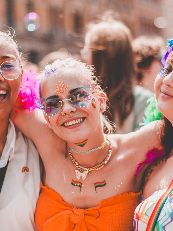 Three girls smiling in the Oslo Pride parade, 2023