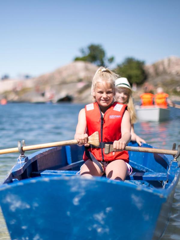 Two children in a rowing boat near Bragdøya outside of Kristiansand, Southern Norway