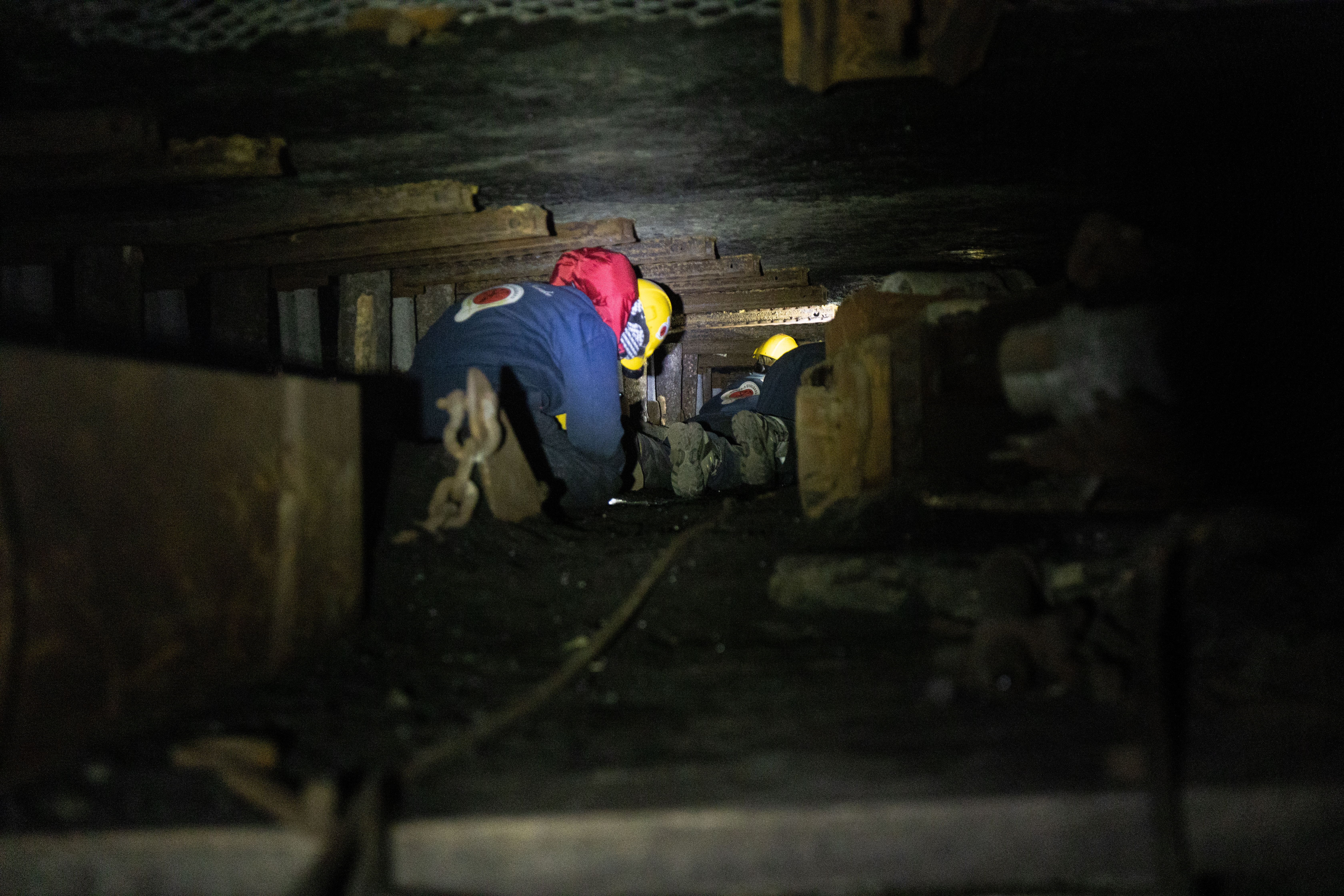 Person climbing in the narrow coal mines at Svalbard, Northern Norway