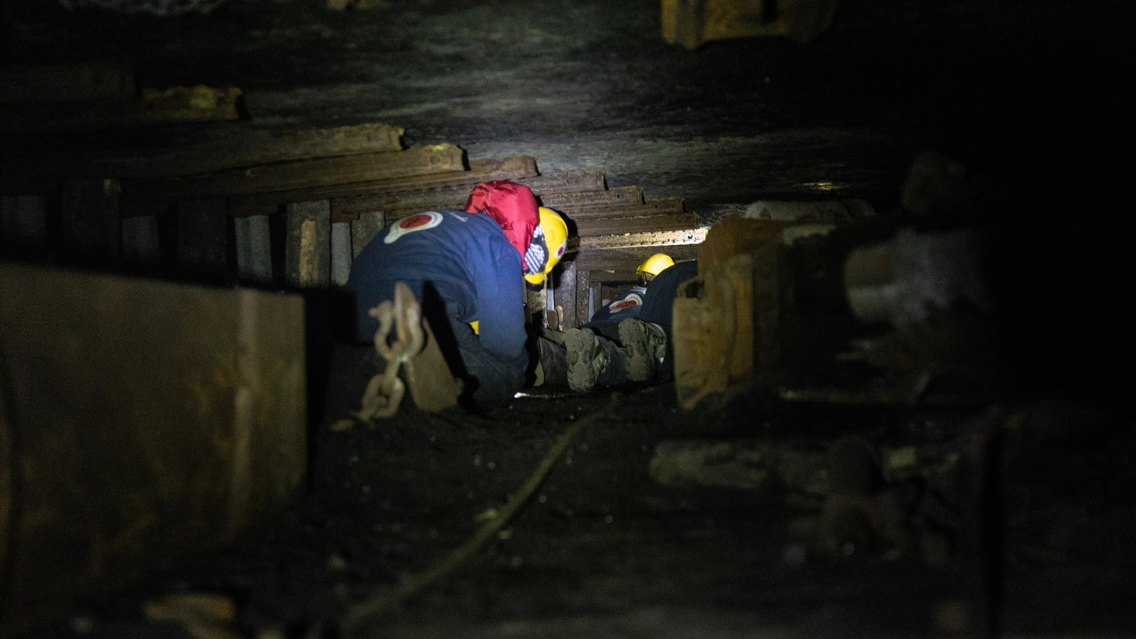 Person climbing in the narrow coal mines at Svalbard, Northern Norway