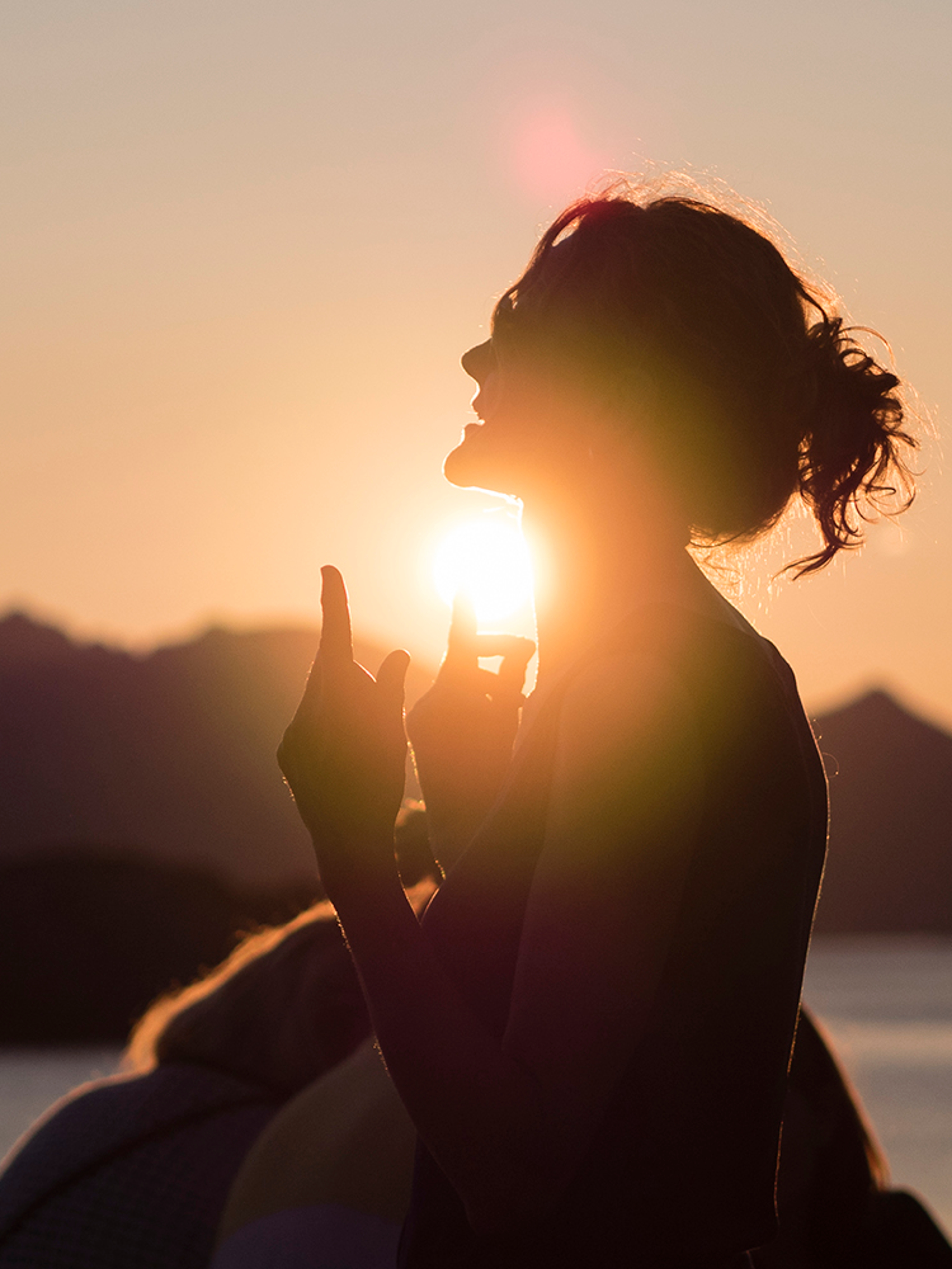 People attending the Trevarefest festival under the midnight sun in Henningsvær, Northern Norway