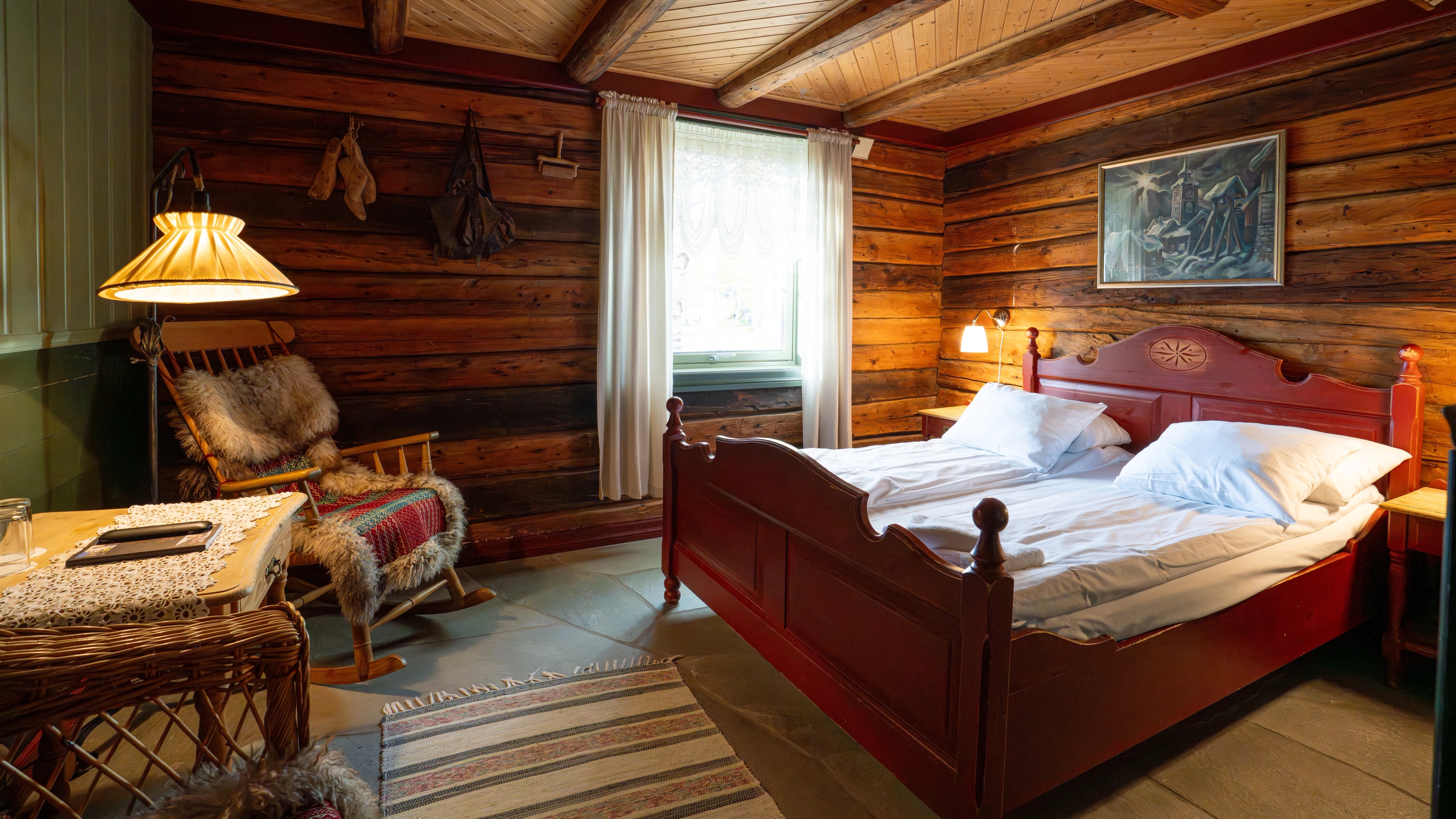 A historic hotel room with wooden panelling and furniture.