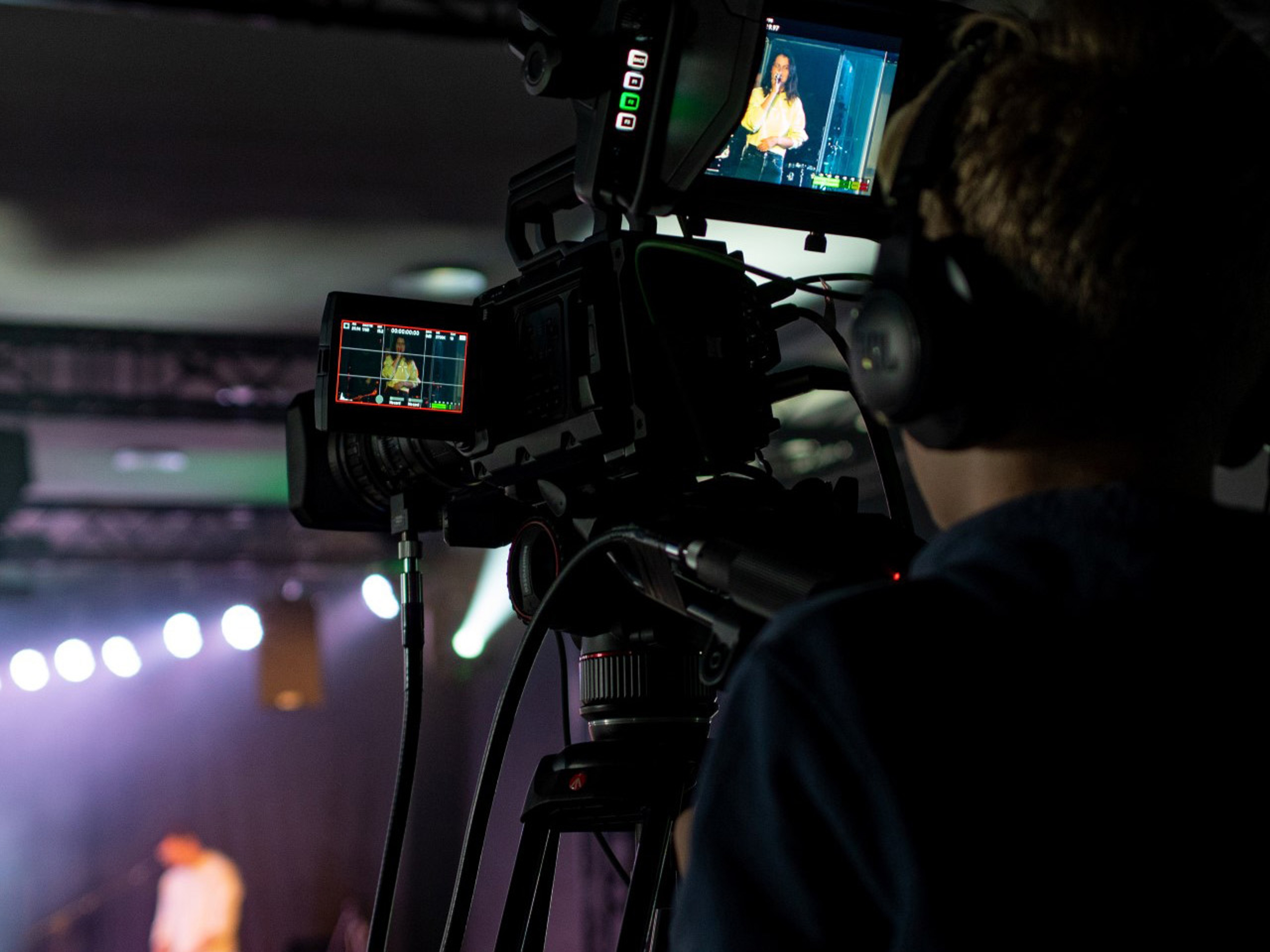 A person with a camera recording a conference at one of the Thon Hotels in Norway