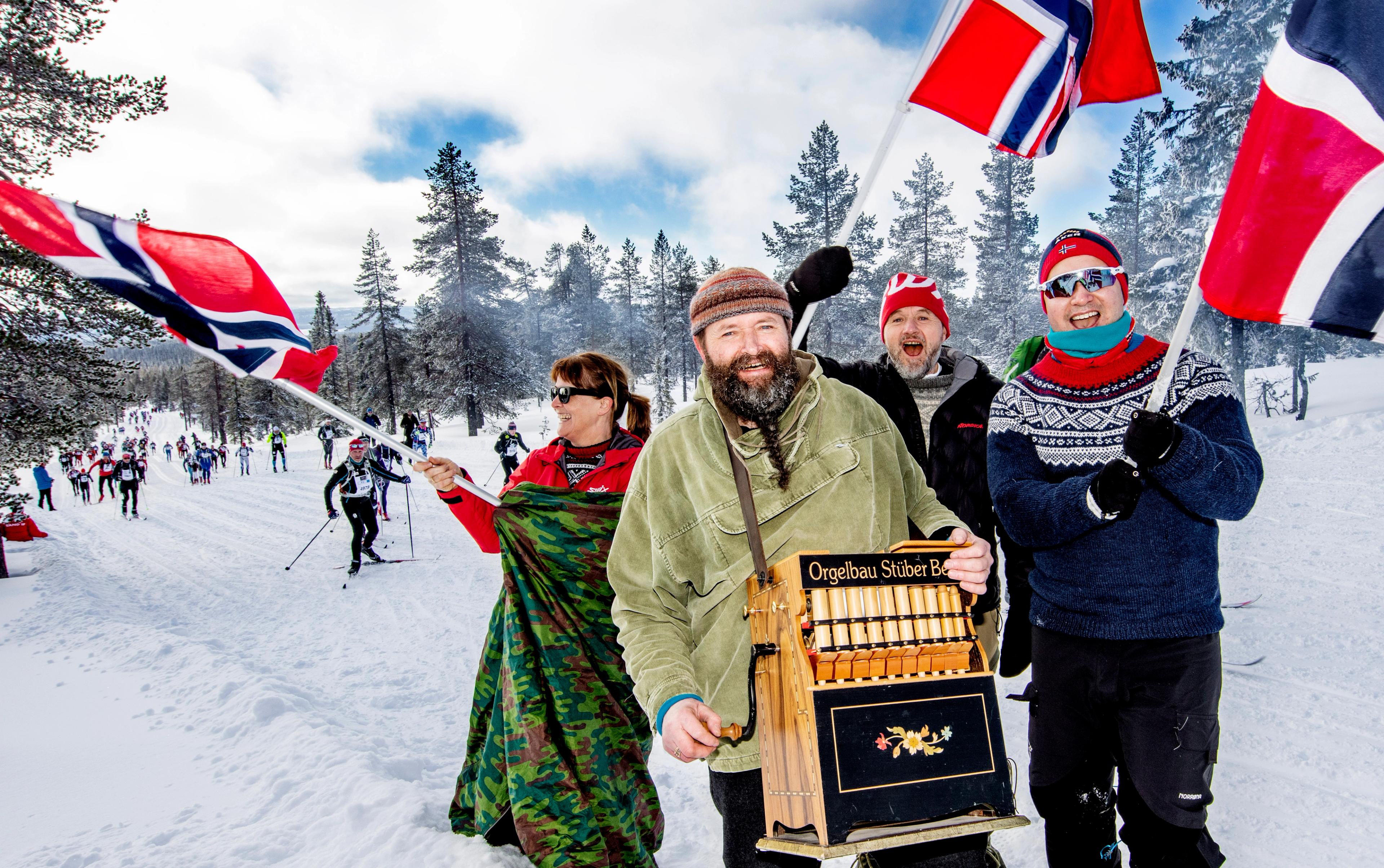 People cheering for skiers during the Birkebeiner ski race, Eastern Norway
