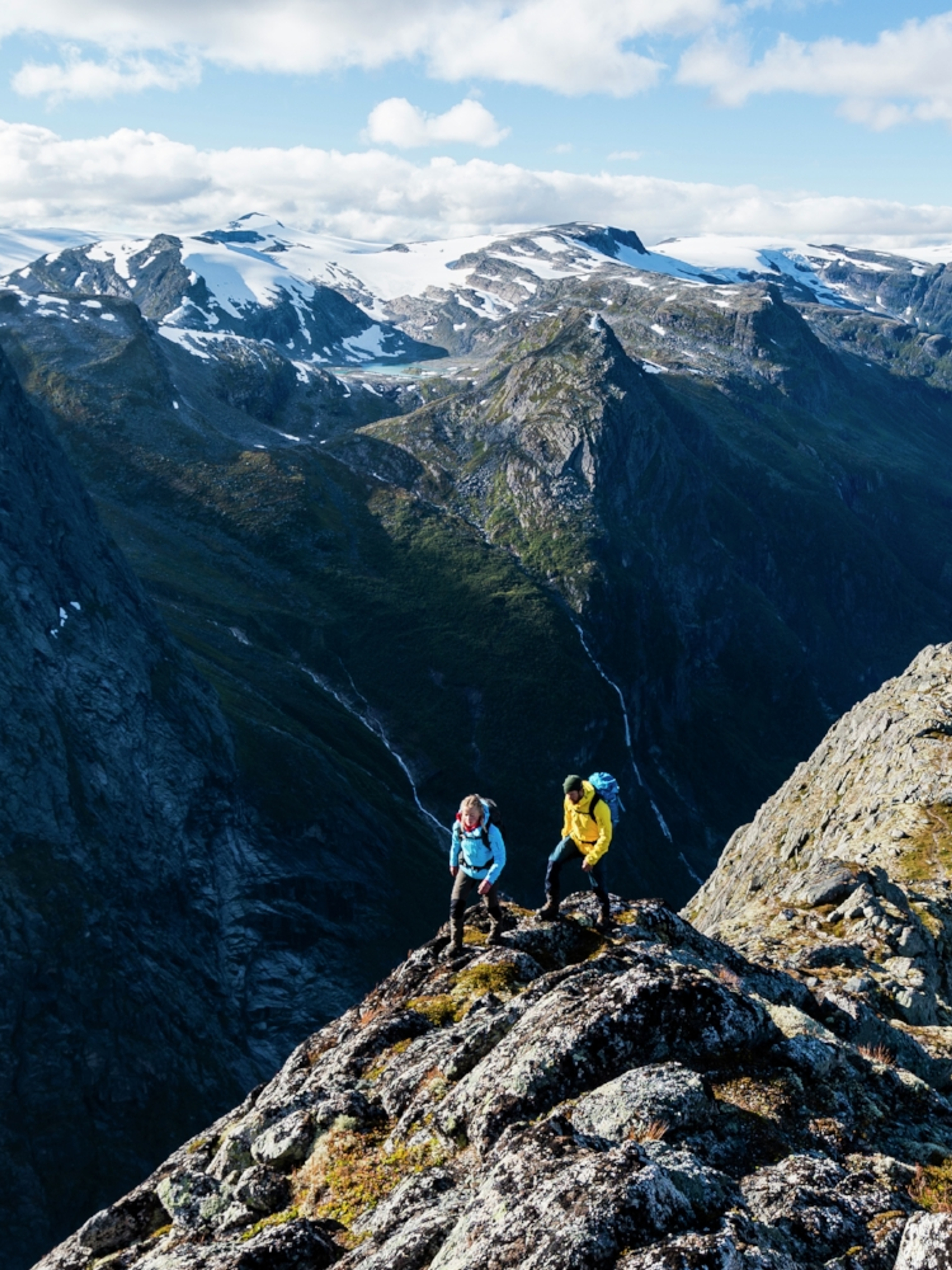 Two people hiking Mount Kattanakken in Jostedalsbreen national park, Fjord Norway
