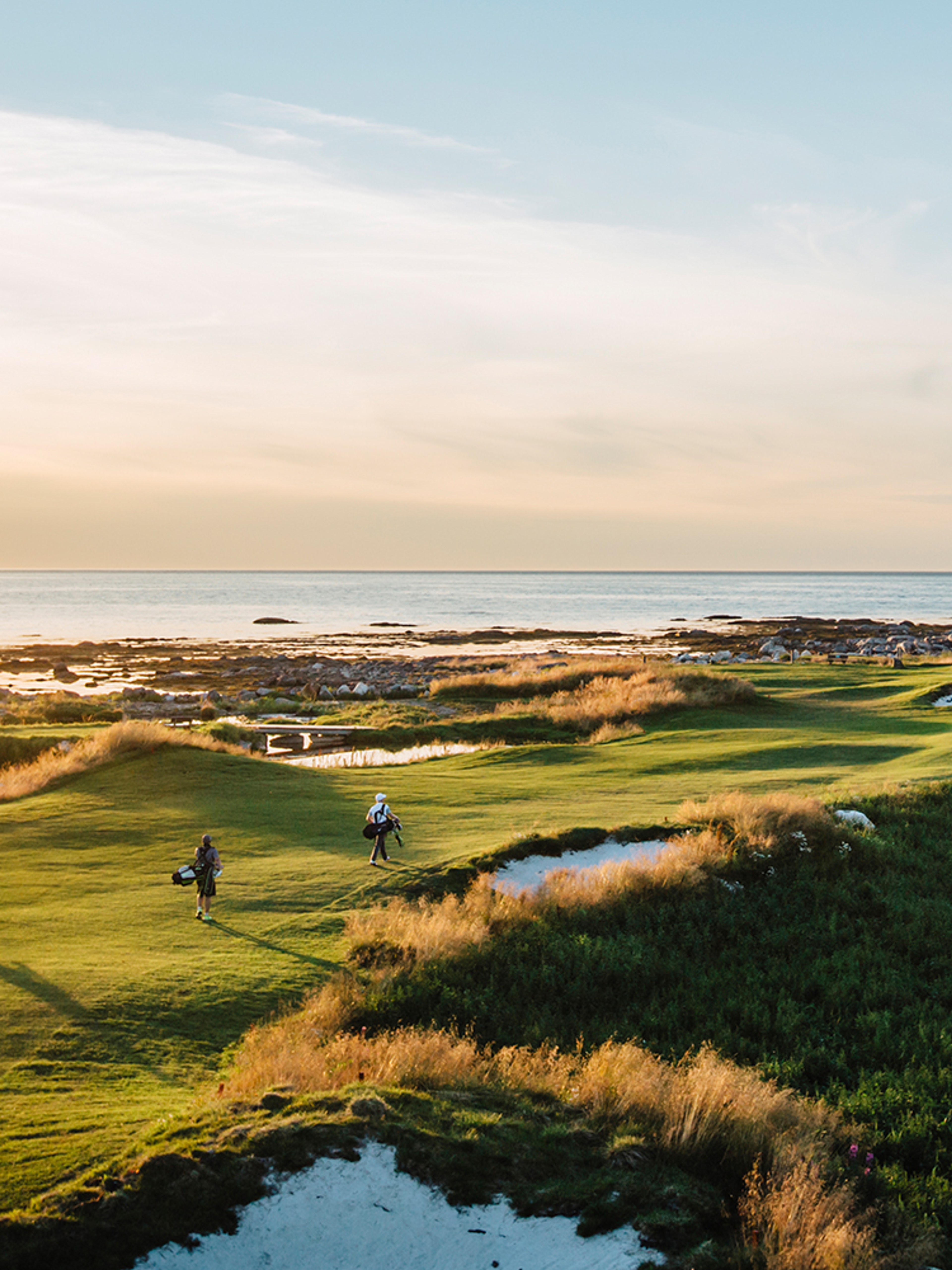 People playing golf under the midnight sun at Lofoten Links in Northern Norway