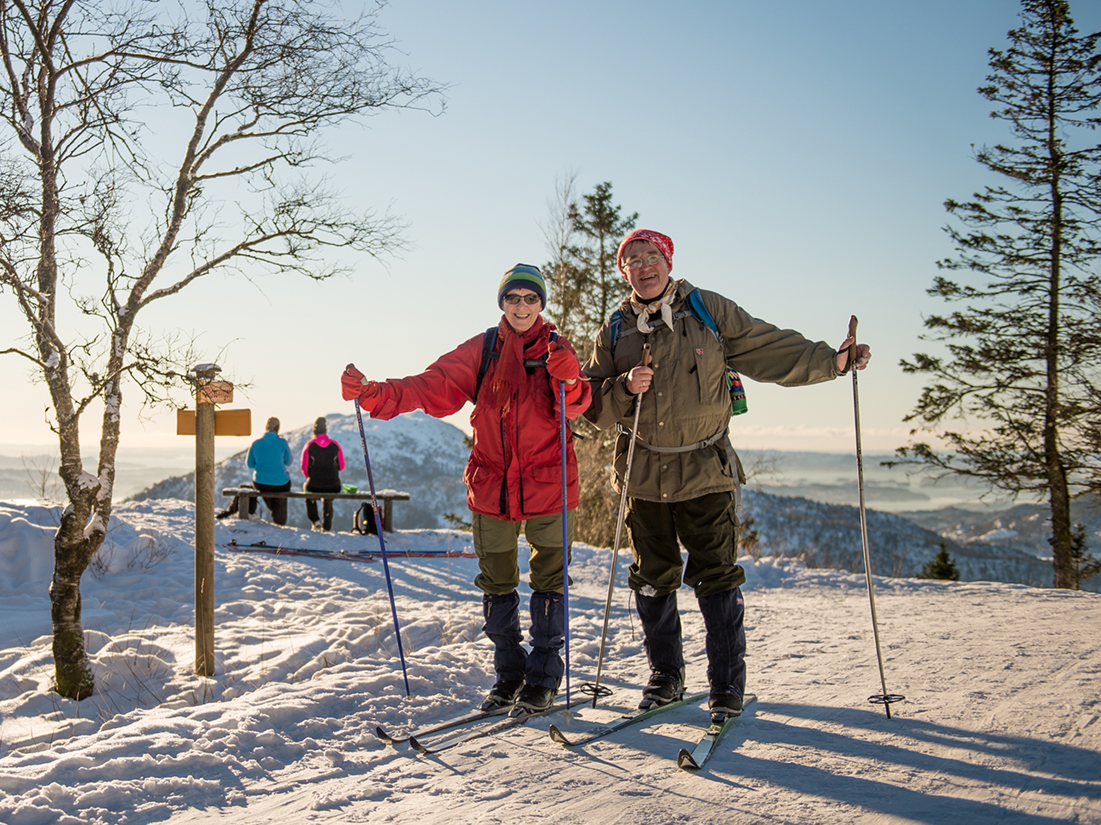 An elderly couple cross-country skiing at Mount Fløyen in Bergen, Fjord Norway