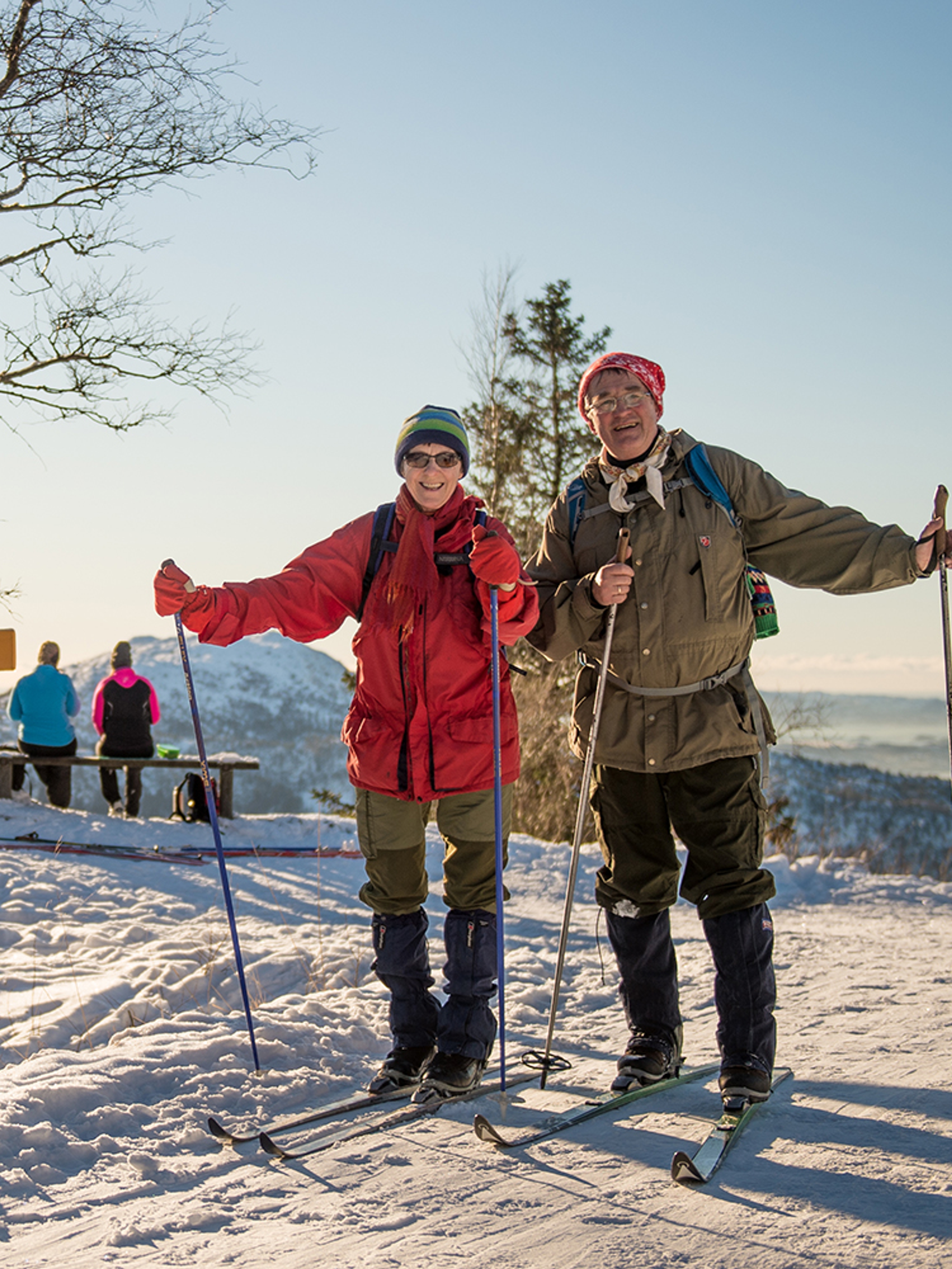 An elderly couple cross-country skiing at Mount Fløyen in Bergen, Fjord Norway