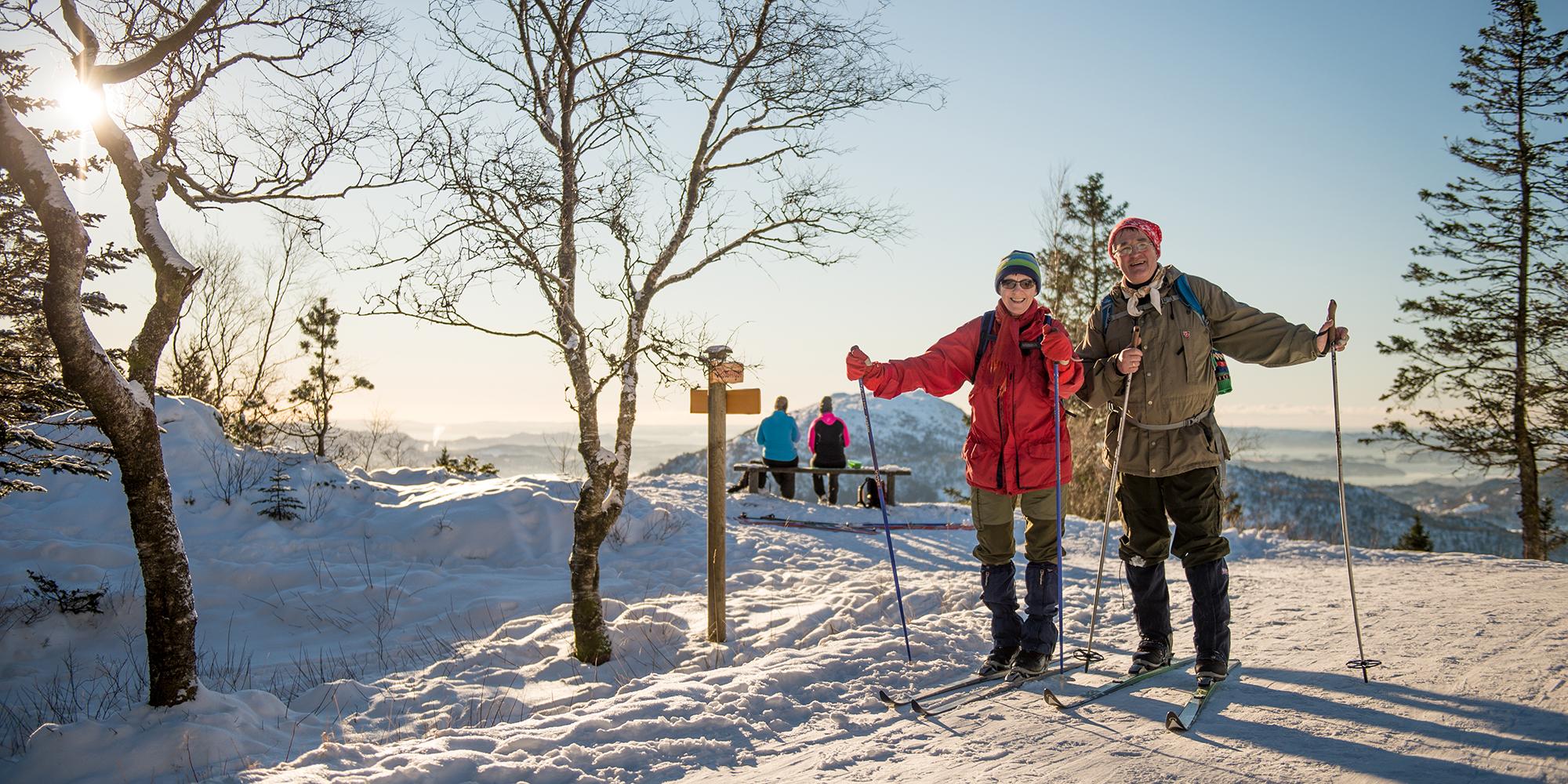 An elderly couple cross-country skiing at Mount Fløyen in Bergen, Fjord Norway