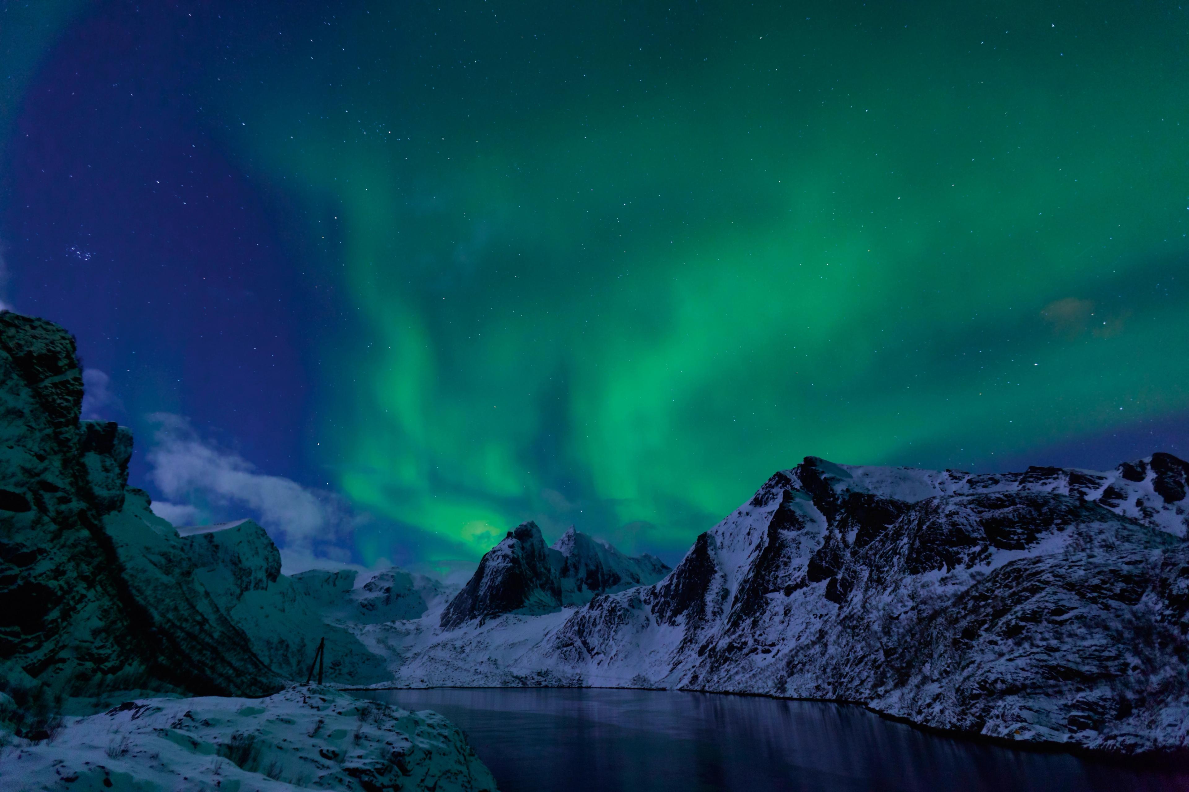 Northern lights over mountains in the Lofoten Islands in Northern Norway
