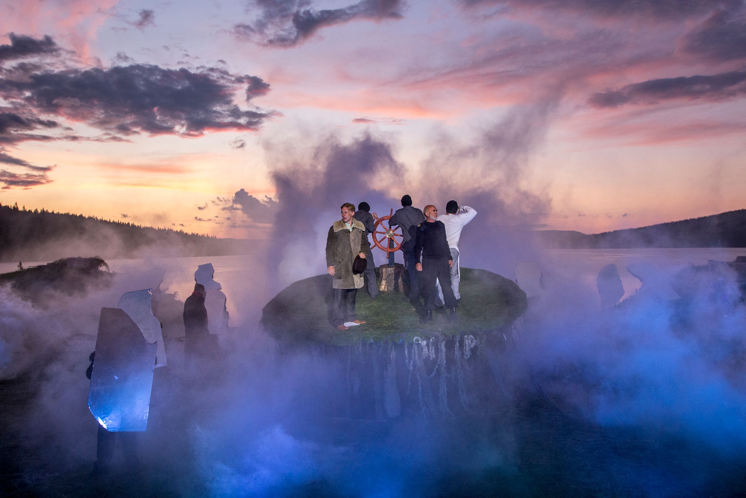 Multiple actors on stage, surrounded by smoke at the Peer Gynt Festival, Gålå, Eastern Norway