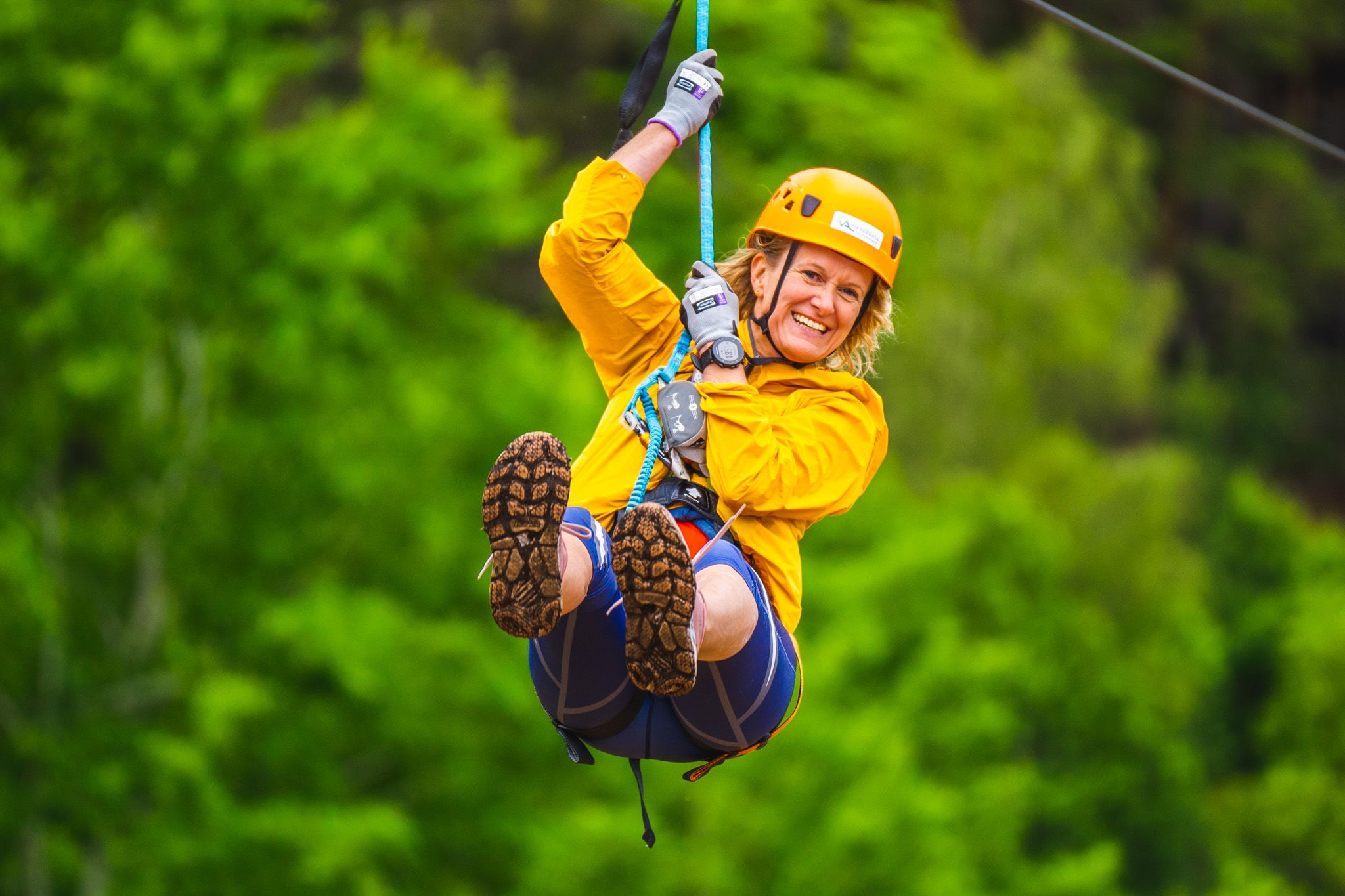Woman in a zip line at Via Ferrata Haldenkanalen